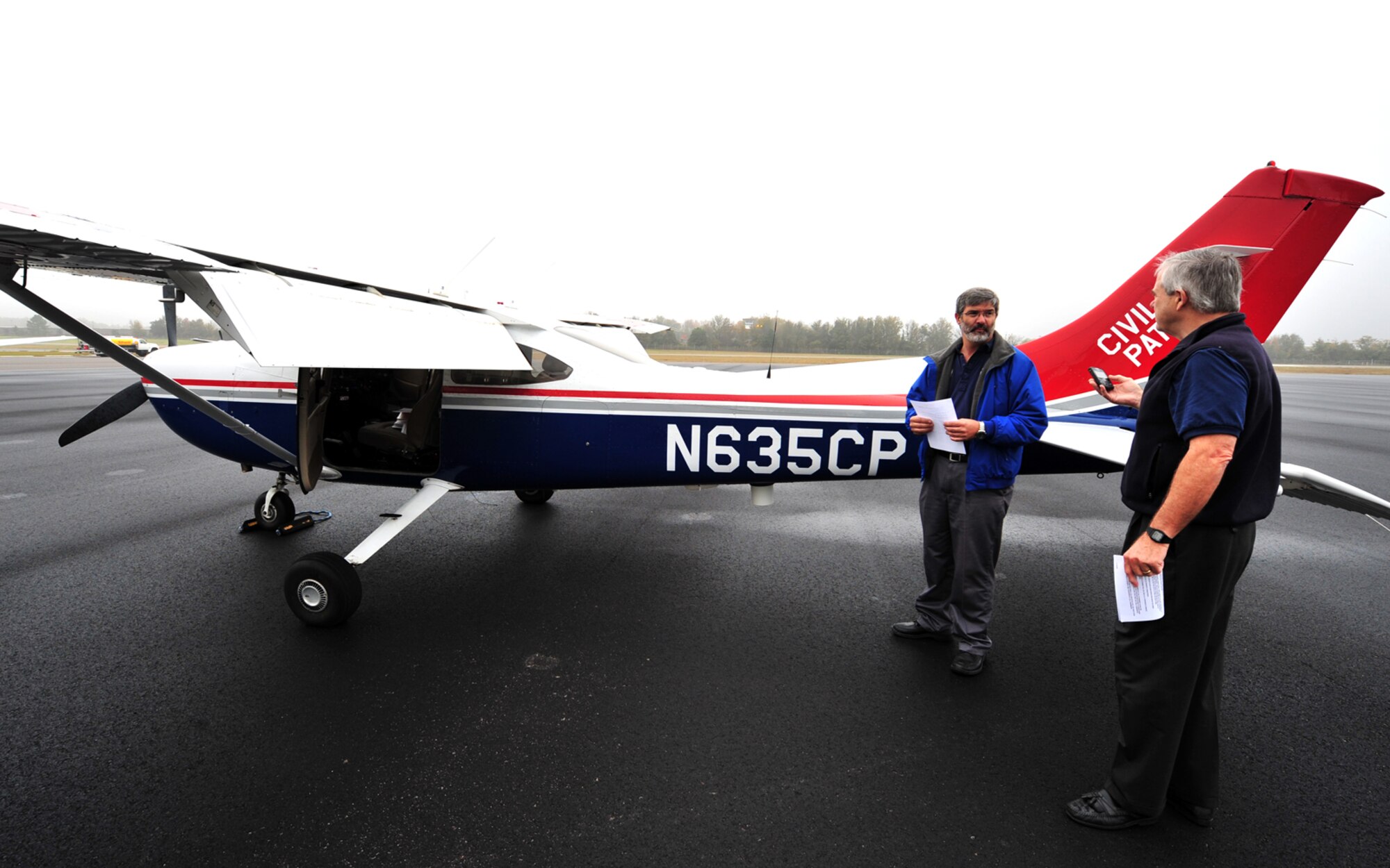 SHAW AIR FORCE BASE, S.C. -- Civil Air Patrol Lt. Col. Michael Ragin, mission observer, right, and CAP Capt. Mike Gill, mission pilot, prepare a Cessna airplane to participate in Fertile Keynote, an exercise conducted by Shaw's alert force Nov. 19.  Once airborne, the aircraft plays the role of a wayward aircraft so F-16 pilots from Shaw's alert force can practice intercepting the plane. The alert mission at Shaw is part of Operation Noble Eagle, which provides quick-reaction support to protect U.S. airspace and significan events like presidential movements and space shuttle launches. (U.S. Air Force photo/Senior Airman Michael Cowley)