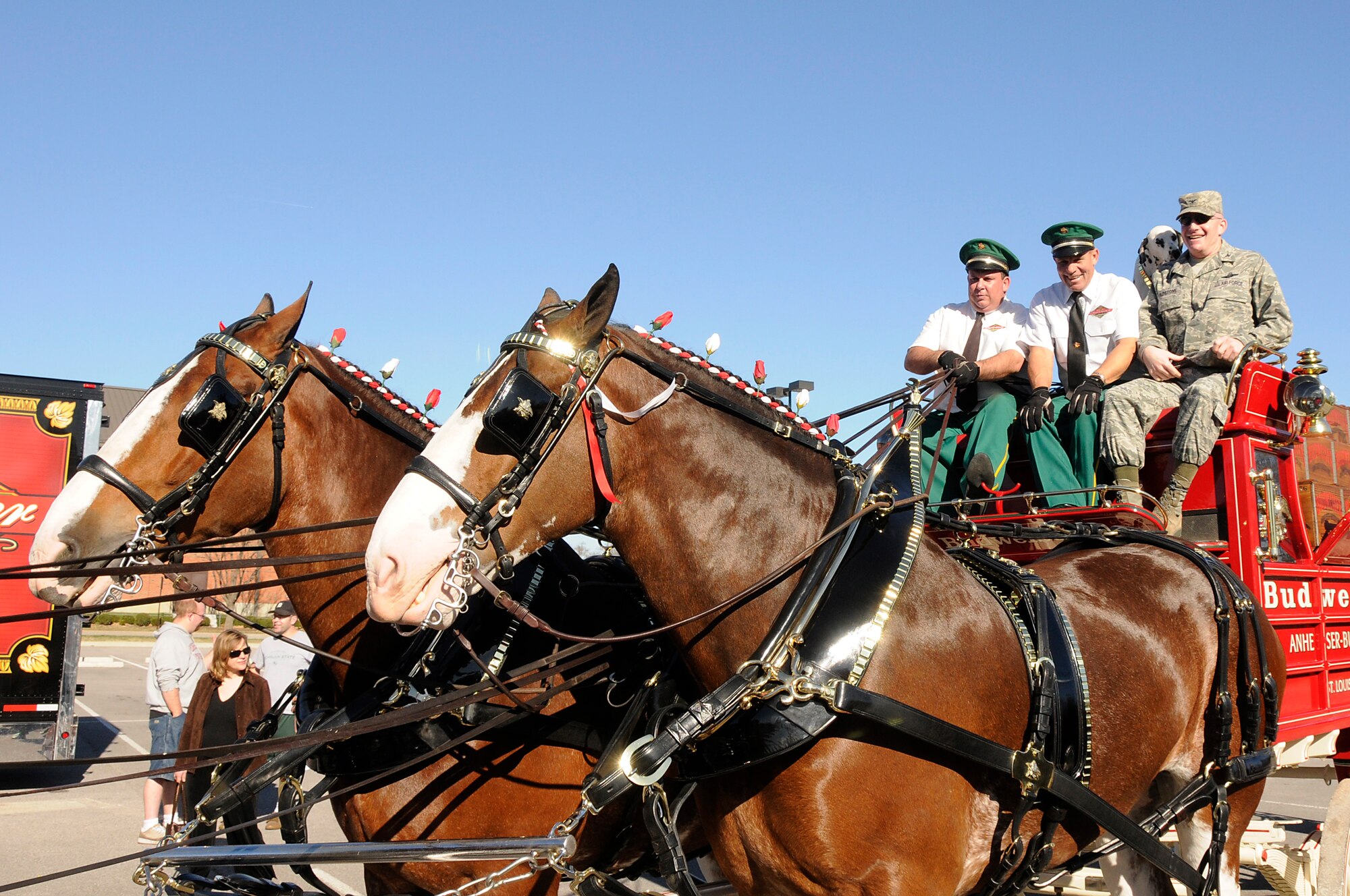 Col. Gary Goldstone, 375th Air Mobility Wing commander, takes off on a ride around the Commissary parking lot with the Anheuser Busch Clydesdales during Scott's holiday kick-off, Nov. 28. The Clydesdales joined Santa and The Bull 93.7 radio station along with volunteers passing out cookies and hot chocolate to kick-off the holiday season. (U.S. Air Force photo by Senior Airman Brian J. Ellis)