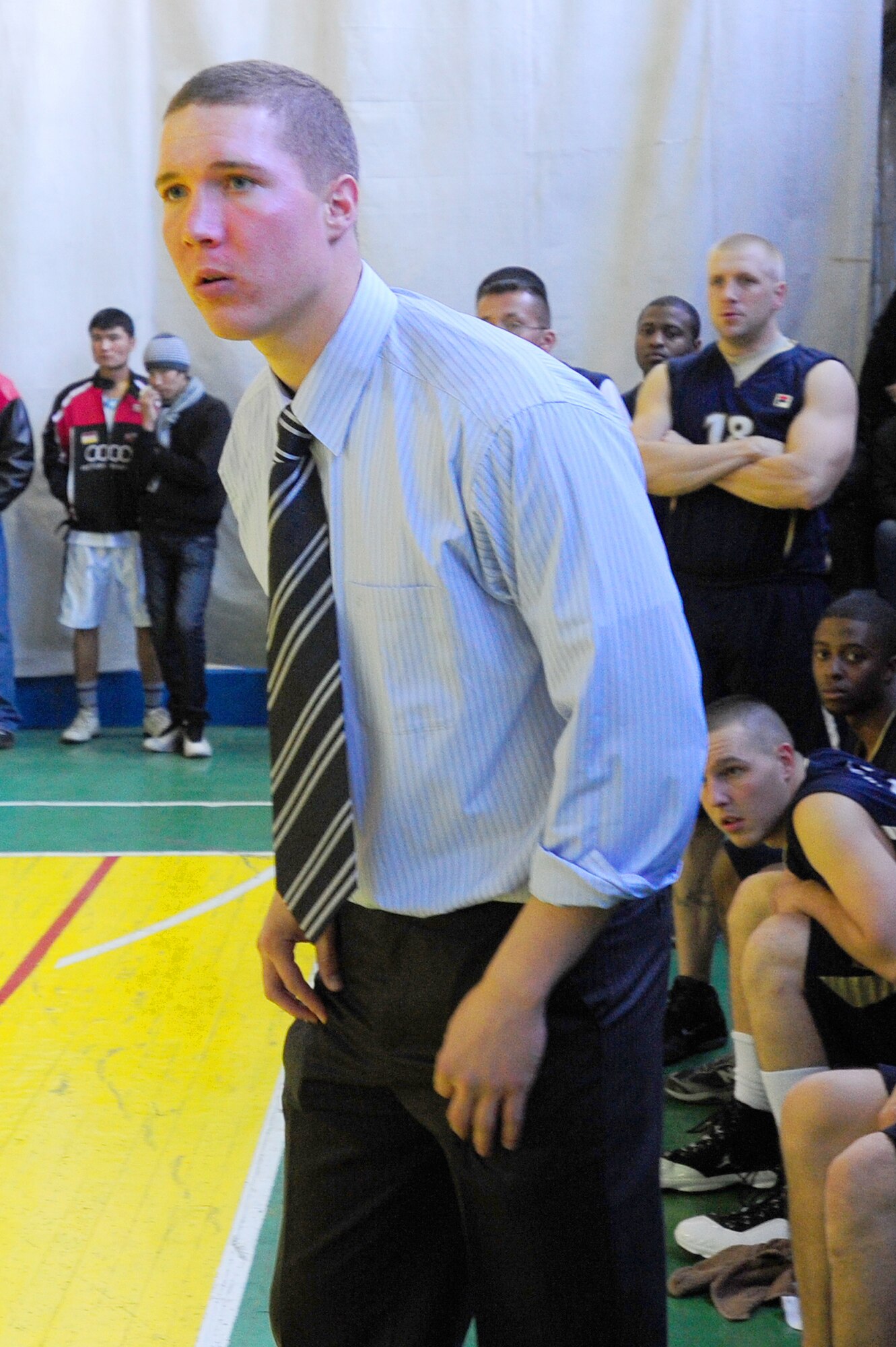 BISHKEK, Kyrgyzstan -- Senior Airman Timothy MacAllister, 376th Expeditionary Security Forces Squadron, coaches during a basketball game hosted by the Kyrgyz head of sport and physical culture, Nov. 20, 2009. (U.S. Air Force photo/Senior Airman Steele C. G. Britton)