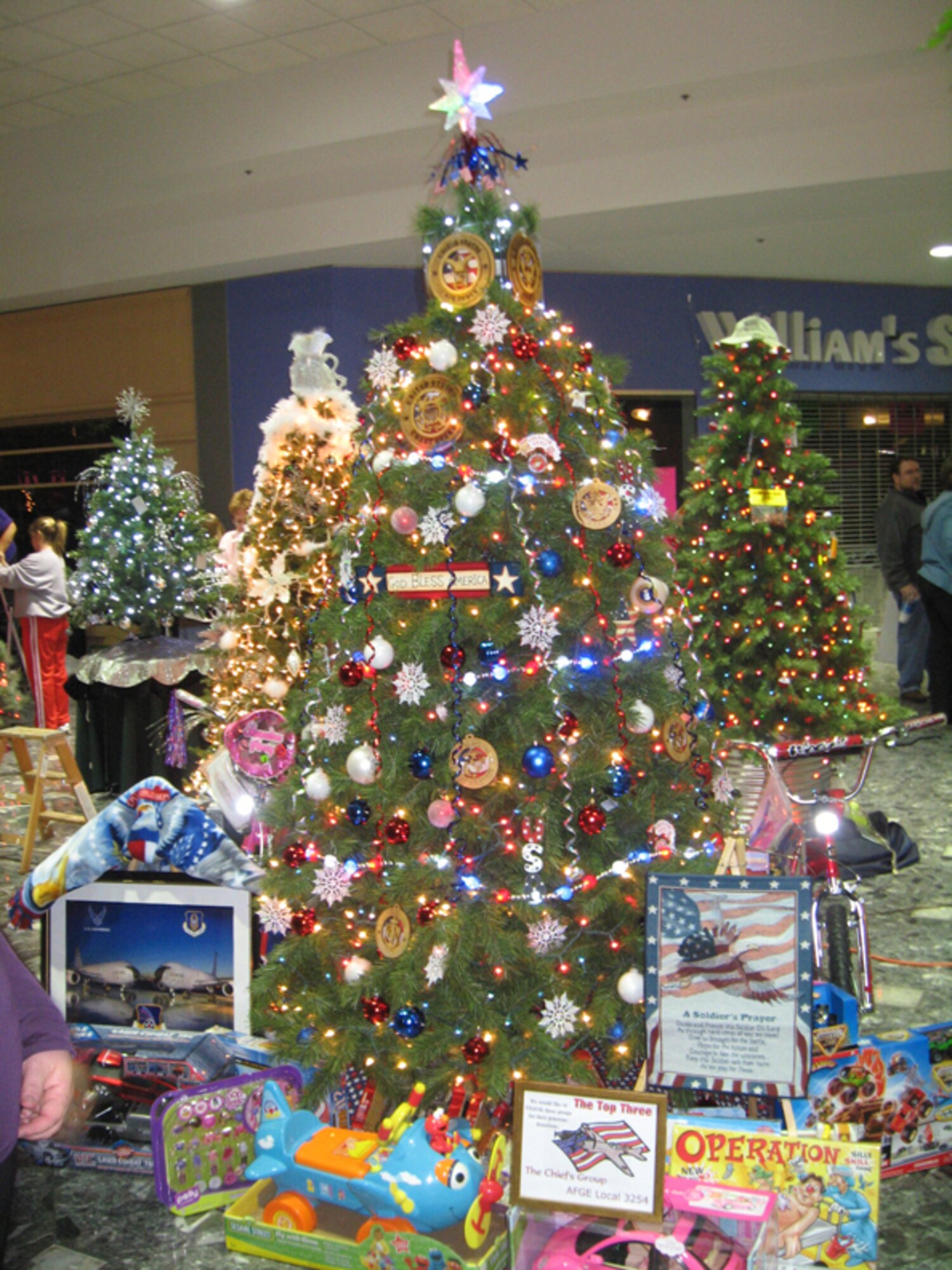 KOKOMO, Ind., -- The Christmas tree prepared by volunteers from the 434th Maintenance Group, family and friends sits in all of its glory prior to a charity auction to help needy families during the Holiday season.  The theme for the tree was "A Red, White and Blue Christmas." (Photo courtesy Keith McAndrews and Ashley Miller)