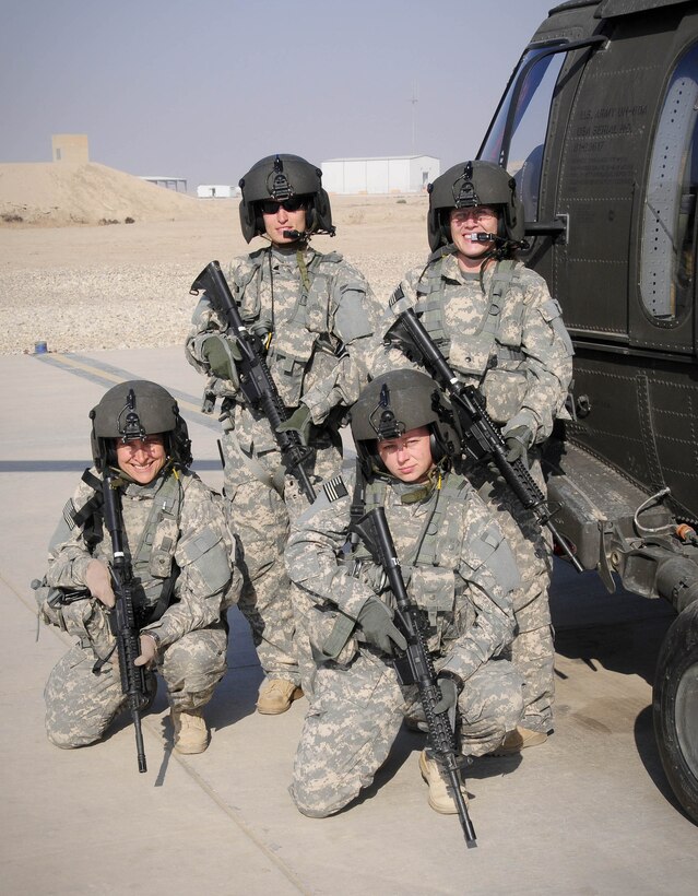 Clockwise from top left, Capt. Trish Barker, Chief Warrant Officer Andrea Galatian, Staff Sgt. Misty Seward and Sgt. Debra Lukan, of the Army’s 3-238th Medevac, C Company, became the company's first all-female crew just
before Thanksgiving. They are serving in Iraq as part of Task Force Keystone. U.S. Army photo by Sgt. Neil Gussman
