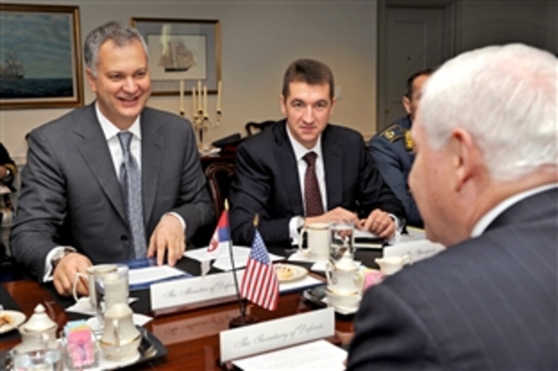 Serbian Defense Minister Dragan Sutanovac, left, meets with U.S. Defense Secretary Robert M. Gates, right foreground, at the Pentagon, Dec. 1, 2009.  The two defense leaders held security discussions on a range of mainly regional security issues. Serbian State Secretary of Defense Policy Dusan Spasojevic, center, joined the visiting minister.  