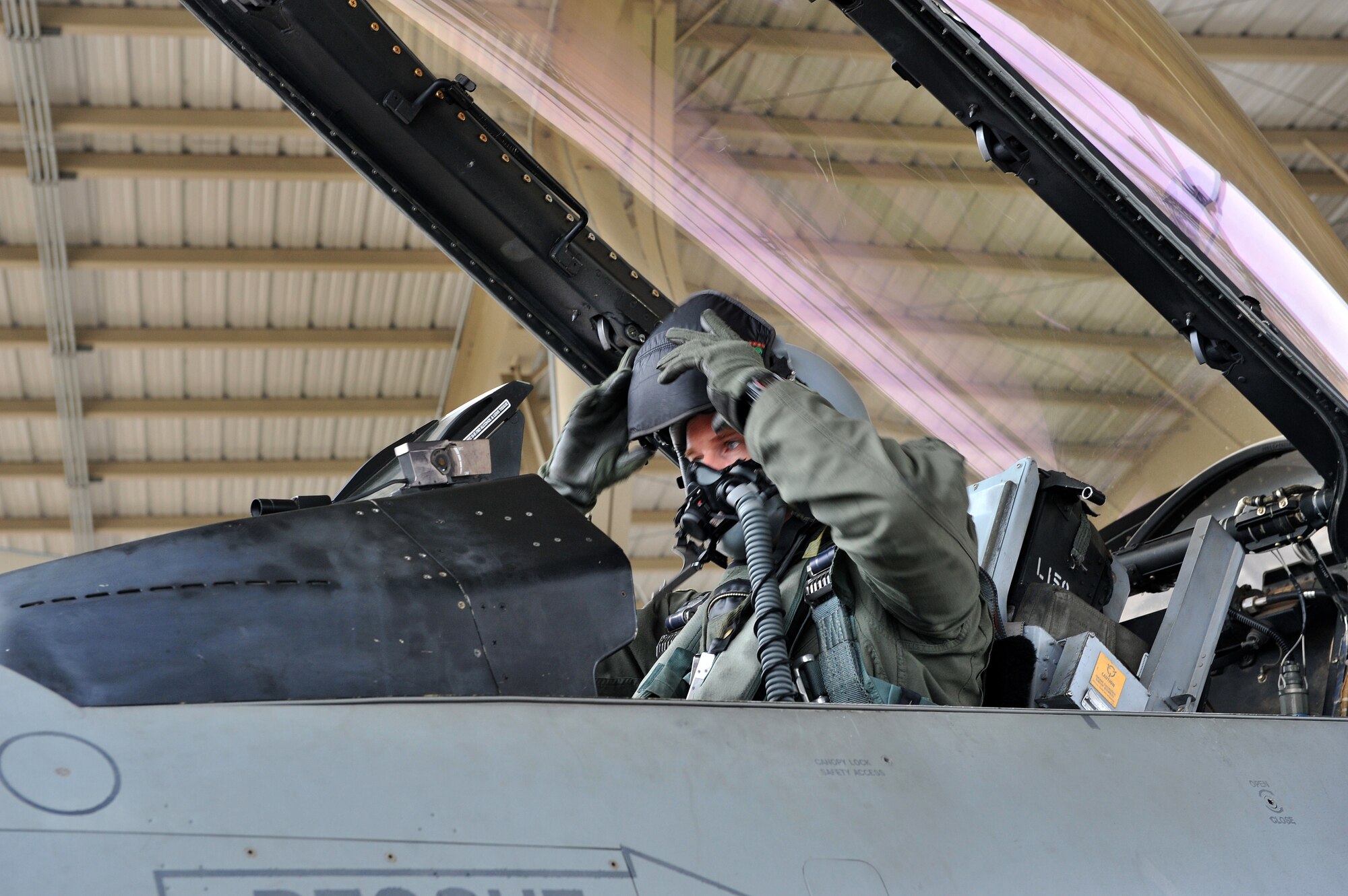 SHAW AIR FORCE BASE, S.C. -- Captain Paul Doughty of the 77th Fighter Squadron dons his helmet prior to takeoff during an operational readiness exercise. The 20th Fighter Wing conducts Phase I OREs to practice deploying. (U.S. Air Force photo/Tech. Sgt. Josef Cole)
