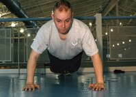 MINOT AIR FORCE BASE, N.D. -- Capt. Matthew Nix, 5th Security Forces Squadron security operator, does push-ups for his physical training test at the McAdoo Sports and Fitness Center here Dec. 1. (U.S. Air Force photo by Airman 1st Class Aaron-Forrest Wainwright)