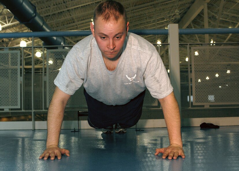 MINOT AIR FORCE BASE, N.D. -- Capt. Matthew Nix, 5th Security Forces Squadron security operator, does push-ups for his physical training test at the McAdoo Sports and Fitness Center here Dec. 1. (U.S. Air Force photo by Airman 1st Class Aaron-Forrest Wainwright)