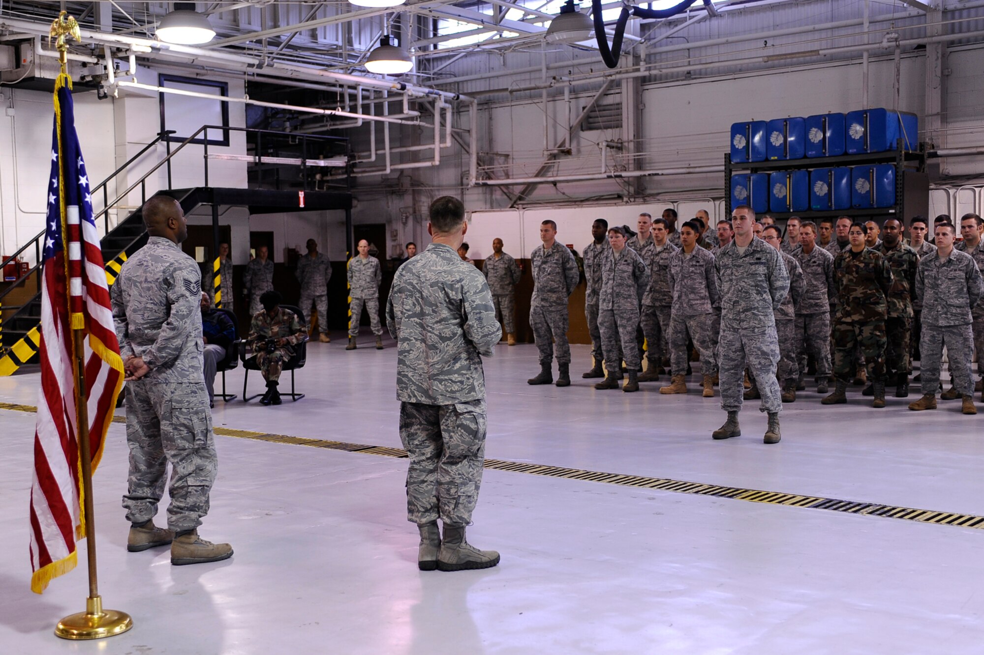 Col. Greg Lengyel, 1st Special Operations Wing commander, addresses members of the 1st Special Operations Logistics Readiness Squadron, after presenting Tech. Sgt. Dameon Jackson, 1st SOLRS, with the Bronze Star at the vehicle maintenance compound at Hurlburt Field Dec. 1. Sergeant Jackson received the medal after serving as convoy commander of the U.S. Army’s 70th Medium Truck Detachment in support of Operation Iraqi Freedom. (Air Force photo by Senior Airman Julianne Showalter)