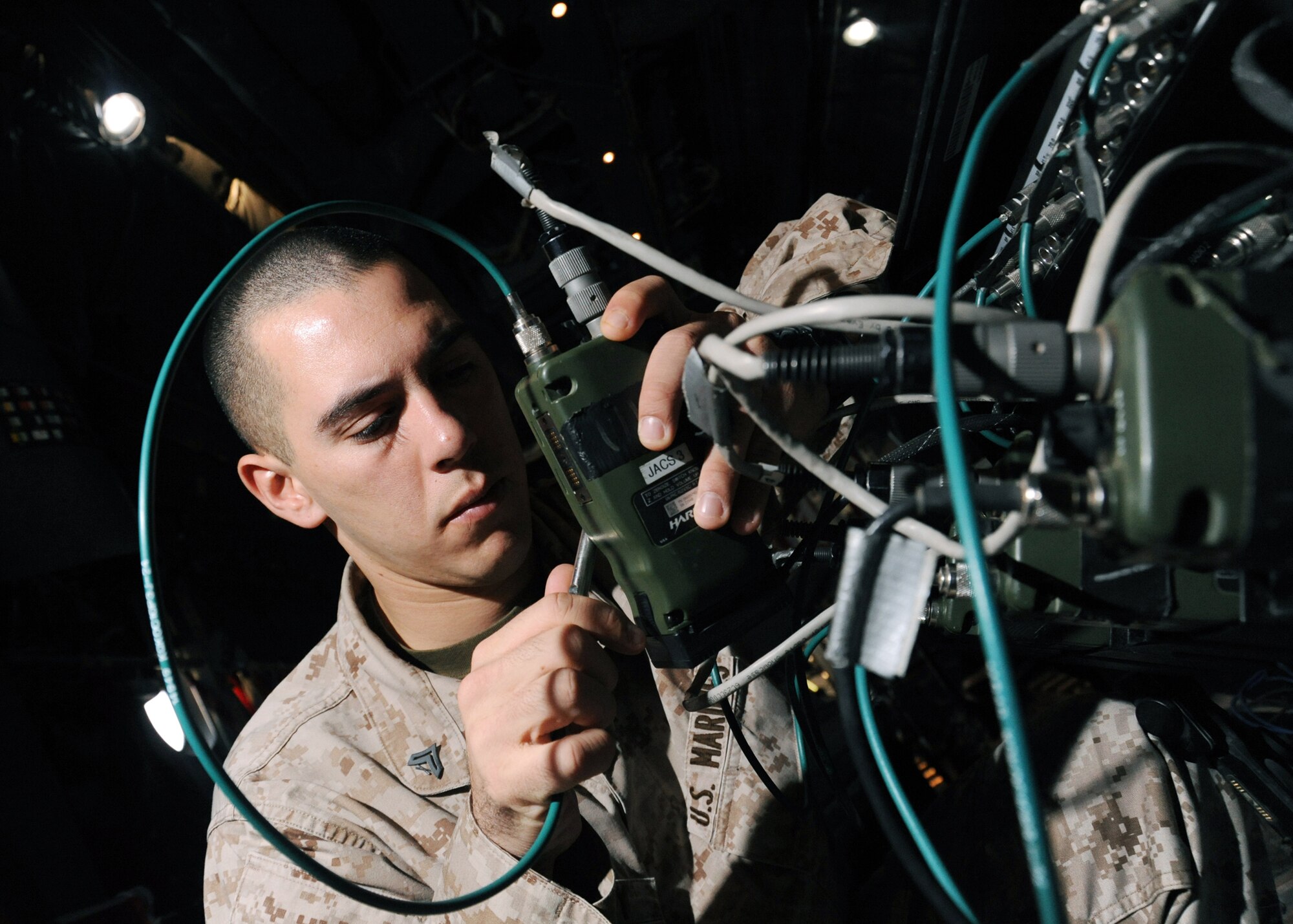 Marine Cpl. Joseph Colby checks the presets and frequencies of radios on a joint airborne battle staff detachment C-130 prior to a mission Nov. 24, 2009 at Joint Base Balad, Iraq. The JABS is a joint operation focused on providing airborne communications support to ground forces. Corporal Colby is an 777th Expeditionary Airlift Squadron air control electronics operator. (U.S. Air Force photo/Senior Airman Christopher Hubenthal)