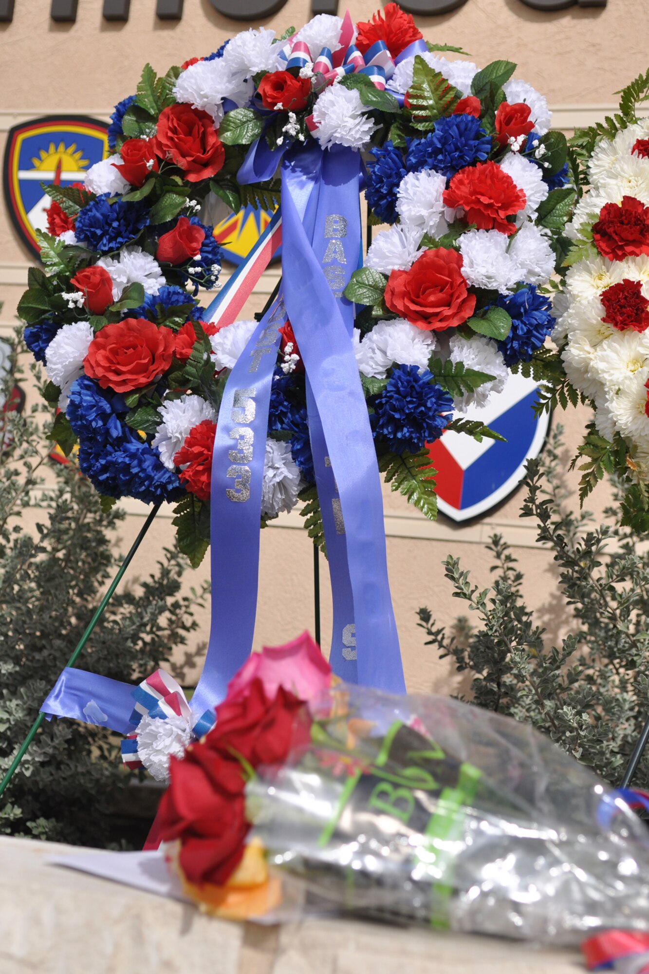 A bouquet of flowers and a personal note lay waiting to be read by someone who will never come. During this holiday season, let us remember to keep our sister-service members and their families in our thought and prayers. At home and abroad, the duties of our uniformed members take them to the farthest reaches of the globe, and our best wishes go with them. (U.S. Air Force photo/Tech. Sgt. Jeff Walston)