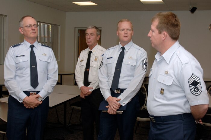 Lt. Gen. Robert Allardice, left, and Chief Master Sgt. James Cody, center, receive a briefing from Chief Master Sgt. Denny Heitman, right, during a tour of the fire department here Nov. 30. General Allardice stopped at Charleston AFB for a two-day visit during his tour of the bases within his command. General Allardice is the 18th Air Force commander and Chief Cody is the 18th Air Force command chief. Chief Heitman is the Fire Chief assigned to the 437th Civil Engineering Squadron. (U.S. Air Force photo/Staff Sgt. Marie Brown)