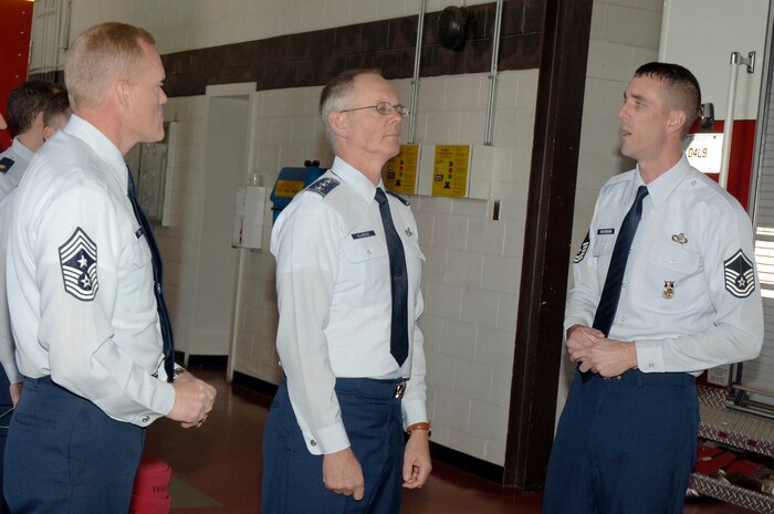Lt. Gen. Robert Allardice, center, and Chief Master Sgt. James Cody, left, receive a briefing from Master Sgt. Mike Patterson, right, during a tour of the fire department here Nov 30.  General Allardice stopped at Charleston AFB for a two-day visit as part of his tour of the bases within his command. General Allardice is the 18th Air Force commander and Chief Cody is the 18th Air Force command chief. Sergeant Patterson is assigned to the 437th Civil Engineering Squadron, fire emergency services. (U.S. Air Force photo/Staff Sgt. Marie Brown)