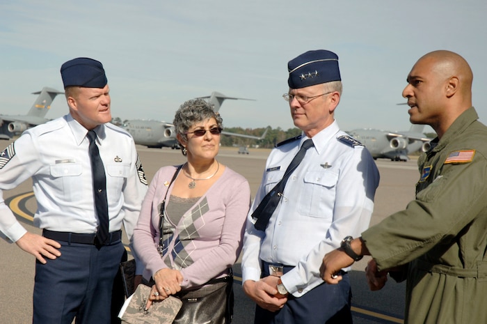 Lt. Gen. Robert Allardice, center right, Mrs. Susan Allardice, center left, and Chief Master Sgt. James Cody, left, receive a briefing on Raven tactics and procedures from Tech. Sgt. Tony Frese, right, on the flightline here Nov 30.  General Allardice stopped at Charleston AFB for a two-day visit during his tour of the bases within his command. General Allardice is the 18th Air Force commander and Susan is his wife. Chief Cody is the 18th Air Force command chief. Sergeant Frese is assigned to the 437th Security Forces Squadron. (U.S. Air Force photo/Staff Sgt. Marie Brown)