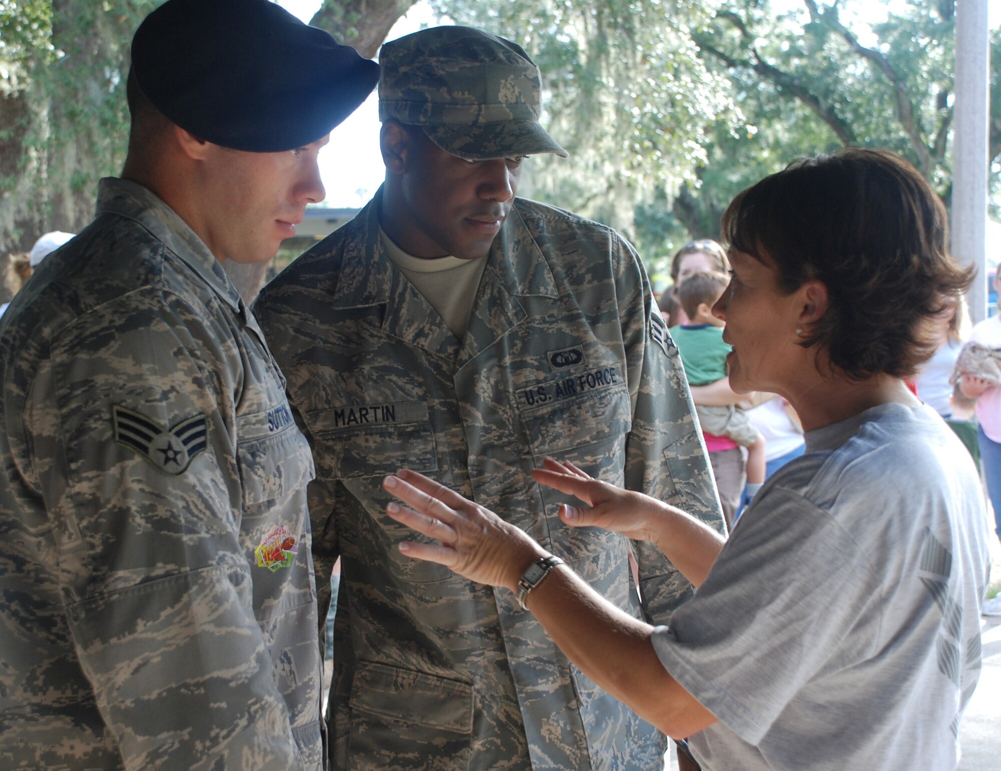 Senior Master Sgt. Vanessa Polk, ALS commandant, discusses Operation Hero with Senior Airmen Austin Sutton, 81st Security Forces Squadron, and Matthew Martin, 81st Operations Support Flight. The class volunteered at the event sponsored by the airman and family readiness center that introduces children of military members to the deployment process.  (U.S. Air Force photo by Senior Airman Kimberly Moore)