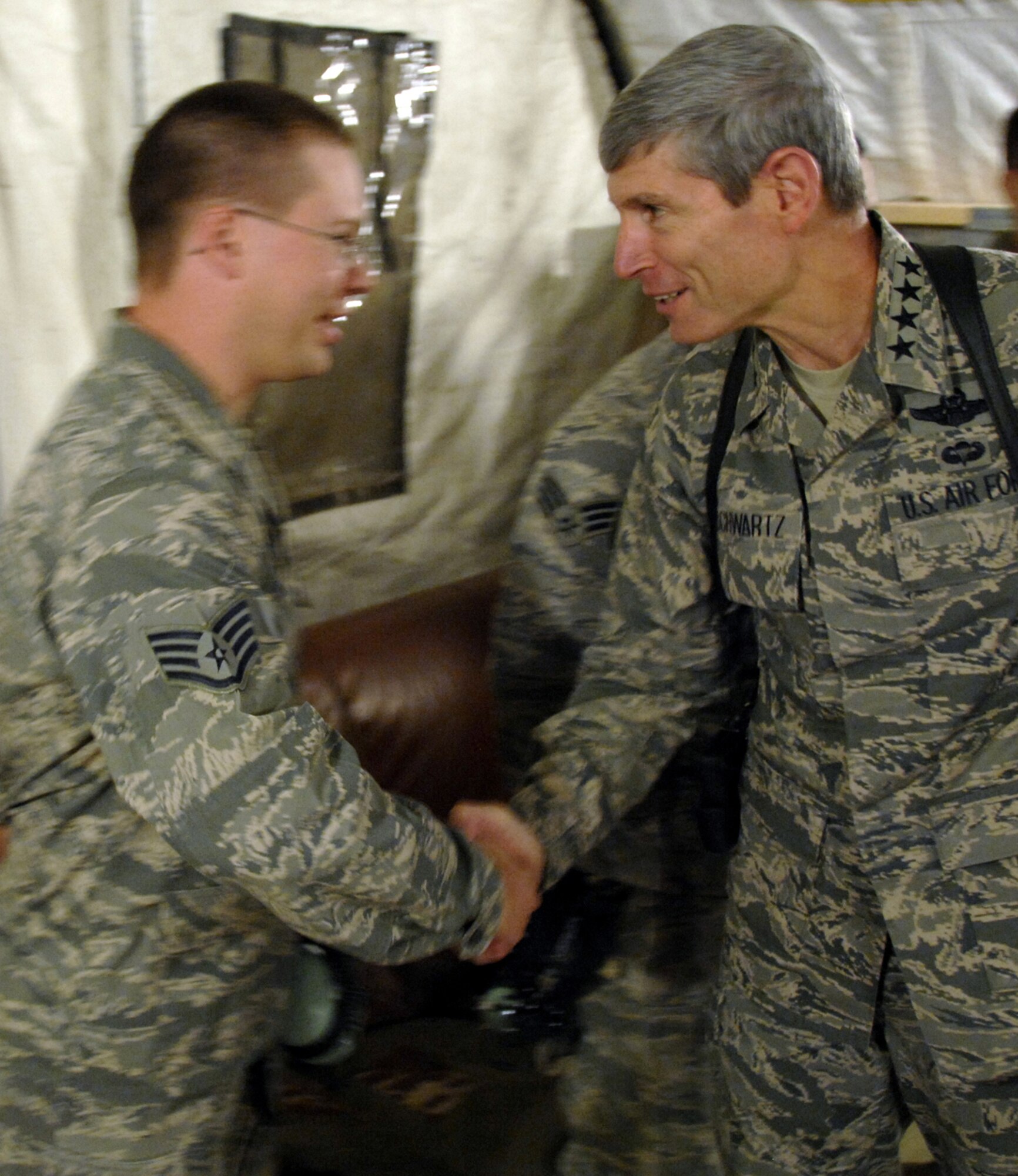KANDAHAR AIRFIELD, Afghanistan - Air Force Chief of Staff Gen. Norton Schwartz visits Airmen at Camp Bastion Nov. 26. General Schwartz and Chief Master Sgt. of the Air Force James Roy celebrated Thanksgiving and had dinner with Airmen assigned to the 451st Air Expeditionary Wing at the forward operating base. (U.S. Air Force photo/Senior Airman Timothy Taylor)
