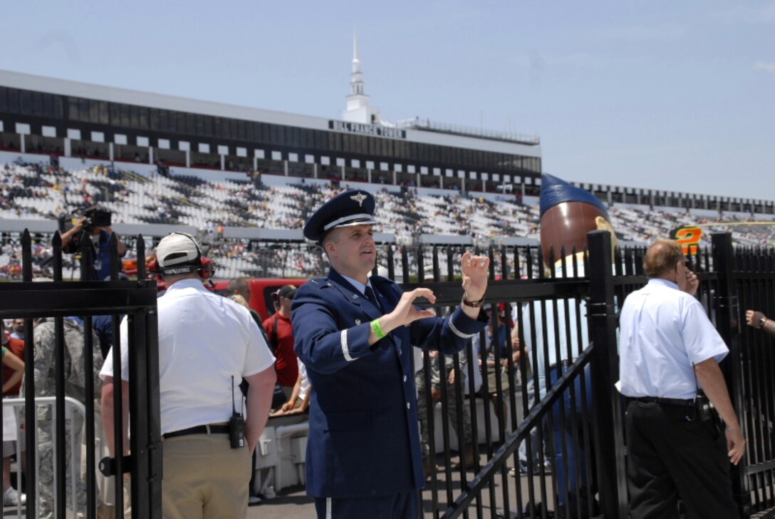 First Lieutenant Joseph Denti conducts the ANG Band of the Mid-Atlantic at Pocono Raceway, Long Pond PA on 3 Aug 2009 for the Pennsylvania 500.