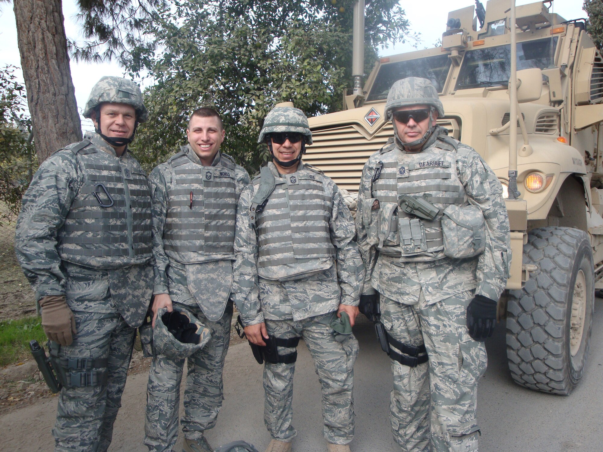 BAGRAM AIR FIELD, Afghanistan -- The former Holloman command chief, Chief Master Sgt. Jeffrey Cui, stops for a photo with the Chief Master Sergeant of the Air Force James Roy, Senior Master Sgt. Nichols, and the command chief who he replaced here, Chief Master Sergeant Scott Dearduff. The CMSAF was visiting the Provincial Reconstruction Team to see how Airmen are contributing to Afghanistan's security, development and governance. (Photo provided)                  