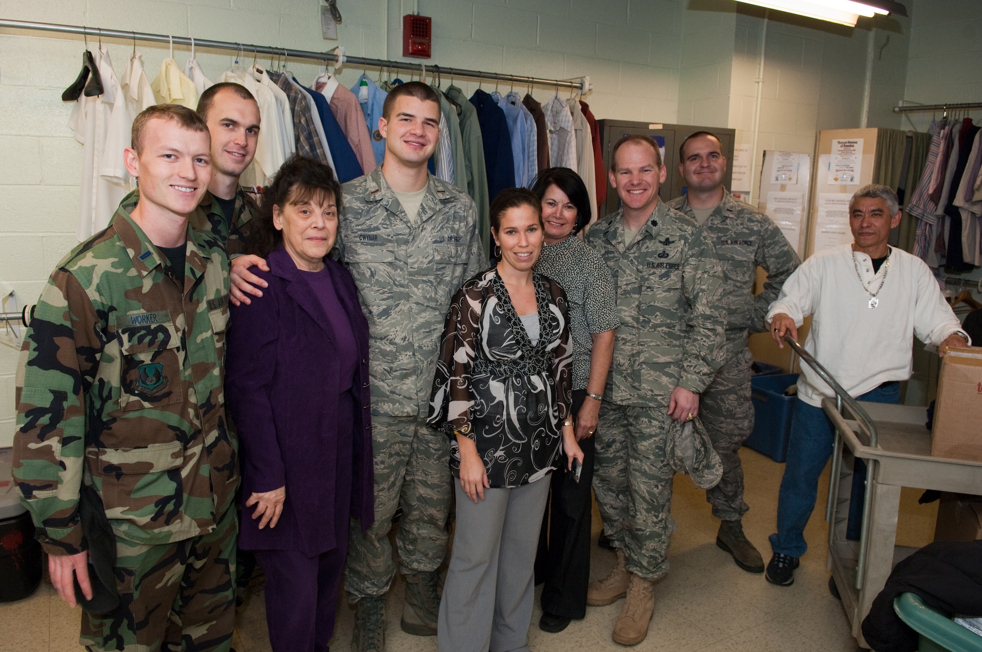 HANSCOM AIR FORCE BASE, Mass. – Members of the Air Force Research Laboratory held a winter clothing drive to collect items to be donated to the Edith Nourse Rogers Veterans Administration Hospital in Bedford, Mass. Volunteers, shown here, sorted through the donated items on Nov. 23 and delivered them to the hospital later that day. Pictured from left to right: 1st Lt. Ben Worker, 1st Lt. Rick Dunn, Harriet St. Onge, 2nd Lt. Ryan Cwynar, Sarah Kelly, Rosa Morales, Lt. Col. Jeff Stutz, 1st Lt. James Grotholson, Miguel Hernandez. (U.S. Air Force photo by Rick Berry)