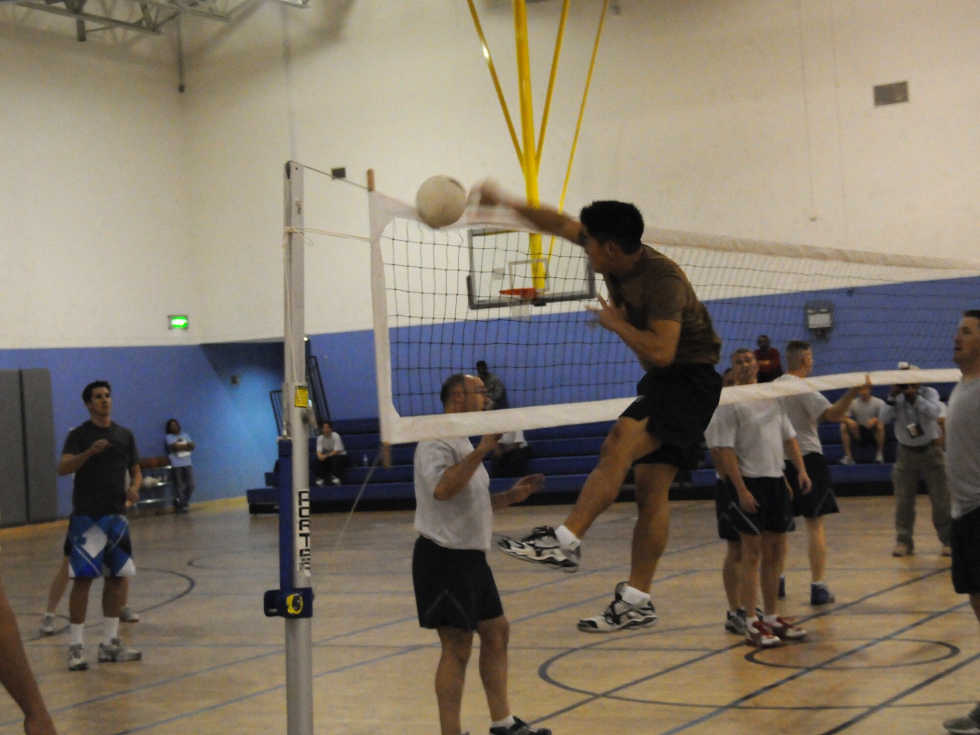 Members of the  Combined Air and Space Operations Center volleyball team face off against the 379th Expeditionary Operations Group team, Nov. 28, 2009. The CAOC team emerged as the base champion in the Intramural Volleyball League for the third consecutive year.
(U.S. Air Force Photo/Tech. Sgt. Jason W. Edwards)
