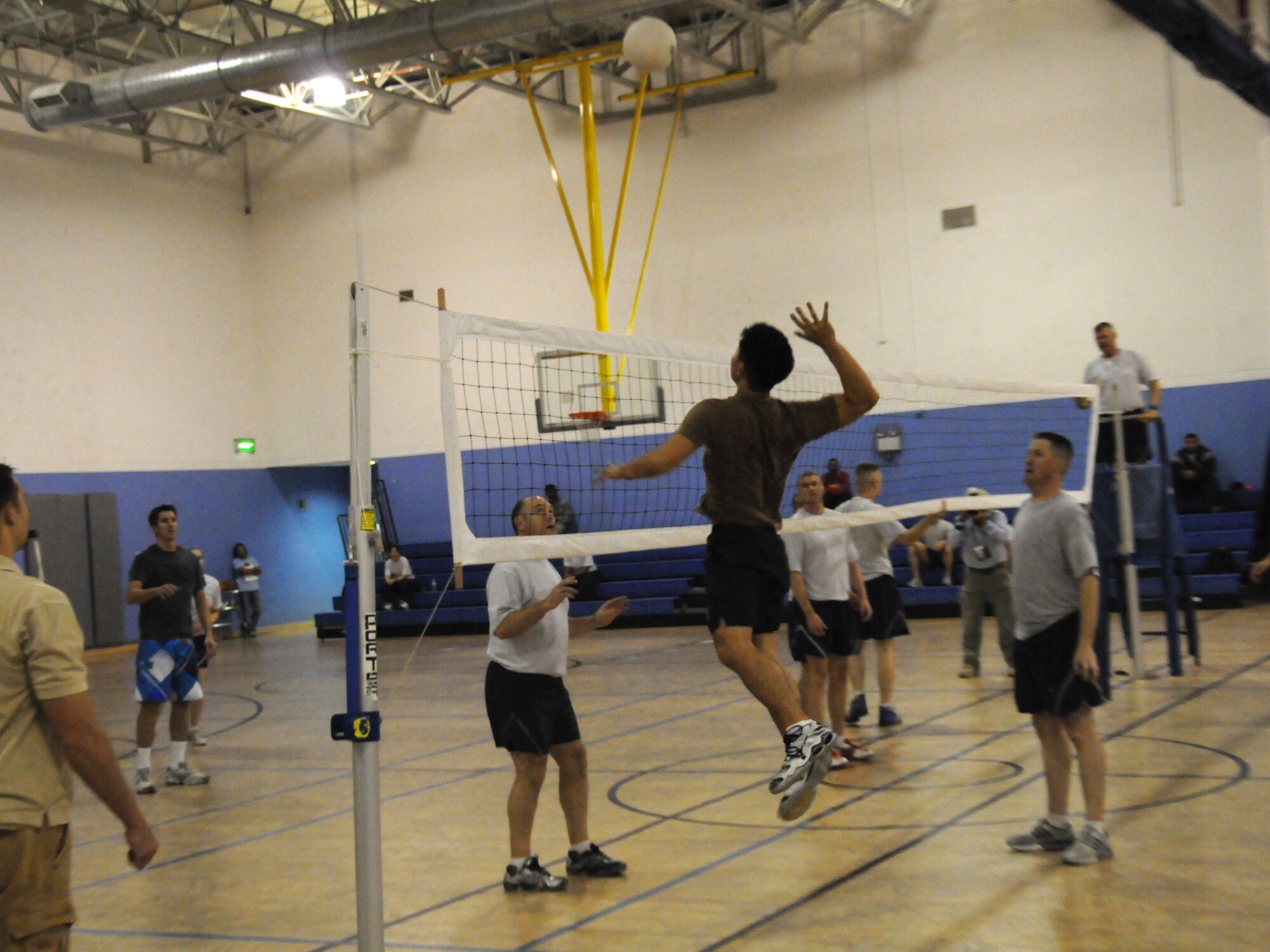 Members of the  Combined Air and Space Operations Center volleyball team face off against the 379th Expeditionary Operations Group team, Nov. 28, 2009. The CAOC team emerged as the base champion in the Intramural Volleyball League for the third consecutive year.
(U.S. Air Force Photo/Tech. Sgt. Jason W. Edwards)