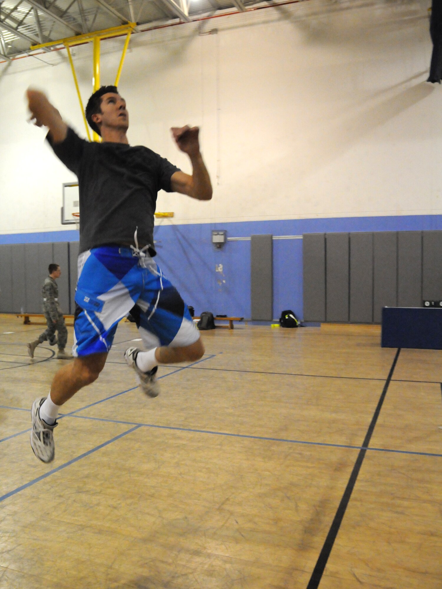 Jason McDonald, Argon ST/TTC Team network engineer, leaps into action with the Combined Air and Space Operations Center volleyball team against the 379th Expeditionary Operations Group team Nov. 28, 2009. The CAOC team emerged as the base champion in the Intramural Volleyball League for the third consecutive year.
(U.S. Air Force Photo/Tech. Sgt. Jason W. Edwards)