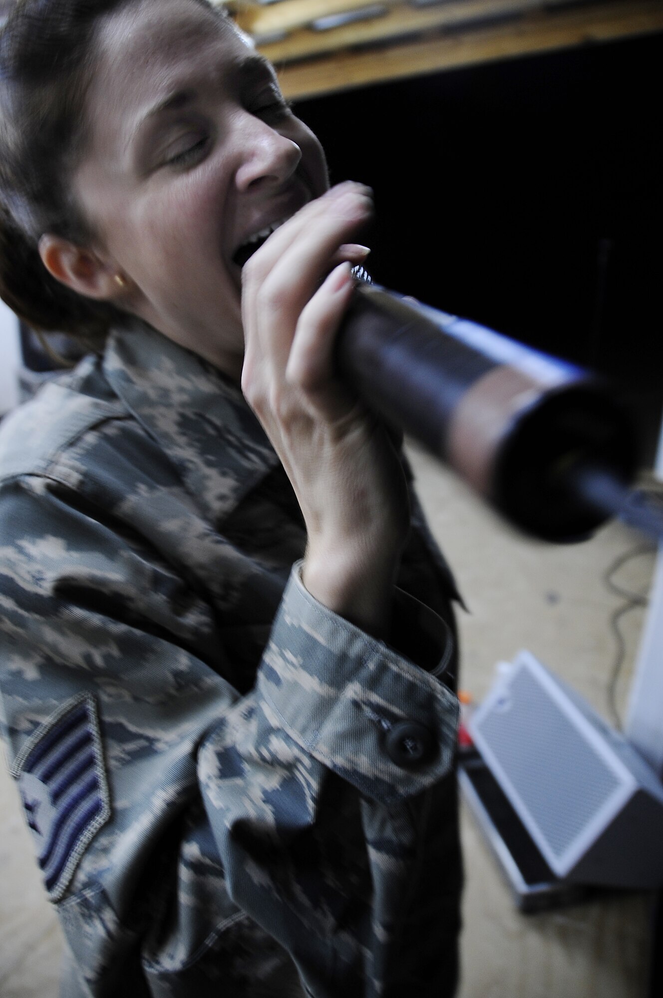 FORWARD OPERATING BASE HUNTER, Iraq -- United States Air Force Tech. Sgt. Christin Foley, vocalist, Air Force Central Command rock band ‘Sirocco’, performs here, Nov. 29, 2009. Sirocco entertained servicemembers and civilians at Ali Base, Contingency Operating Base Adder and Forward Operating Base Hunter, Iraq, over the Thanksgiving Day weekend. (U.S. Air Force photo/Senior Airman Tony R. Ritter) 