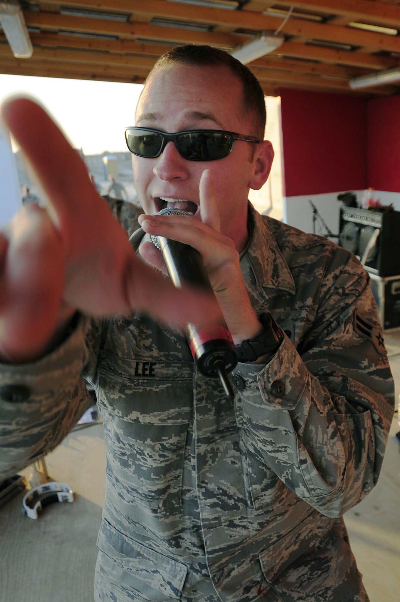 FORWARD OPERATING BASE HUNTER, Iraq -- United States Air Force Airman 1st Class Clayton Lee, vocalist, Air Force Central Command rock band ‘Sirocco’, performs here, Nov. 29, 2009. Sirocco entertained servicemembers and civilians at Ali Base, Contingency Operating Base Adder and Forward Operating Base Hunter, Iraq, over the Thanksgiving Day weekend. (U.S. Air Force photo/Senior Airman Tony R. Ritter) 