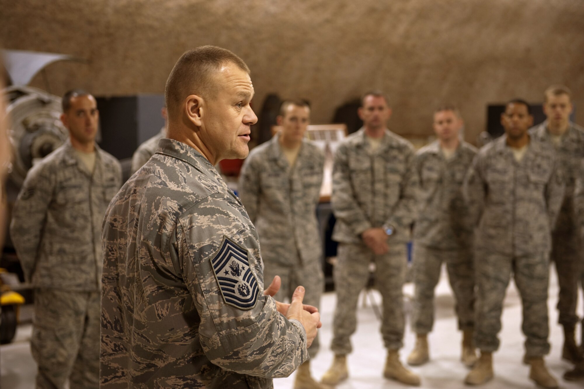 Chief Master Sgt. of the Air Force James A. Roy speaks to 379th Expeditionary Maintenance Squadron Airmen, Nov. 30, 2009. Chief Roy is touring the U.S. Air Forces Central Command area of responsibility, visiting with Airmen and addressing numerous issues affecting servicemembers deployed in support of operations Iraqi Freedom and Enduring Freedom. (U.S. Air Force photo/Staff Sgt. Robert Barney)