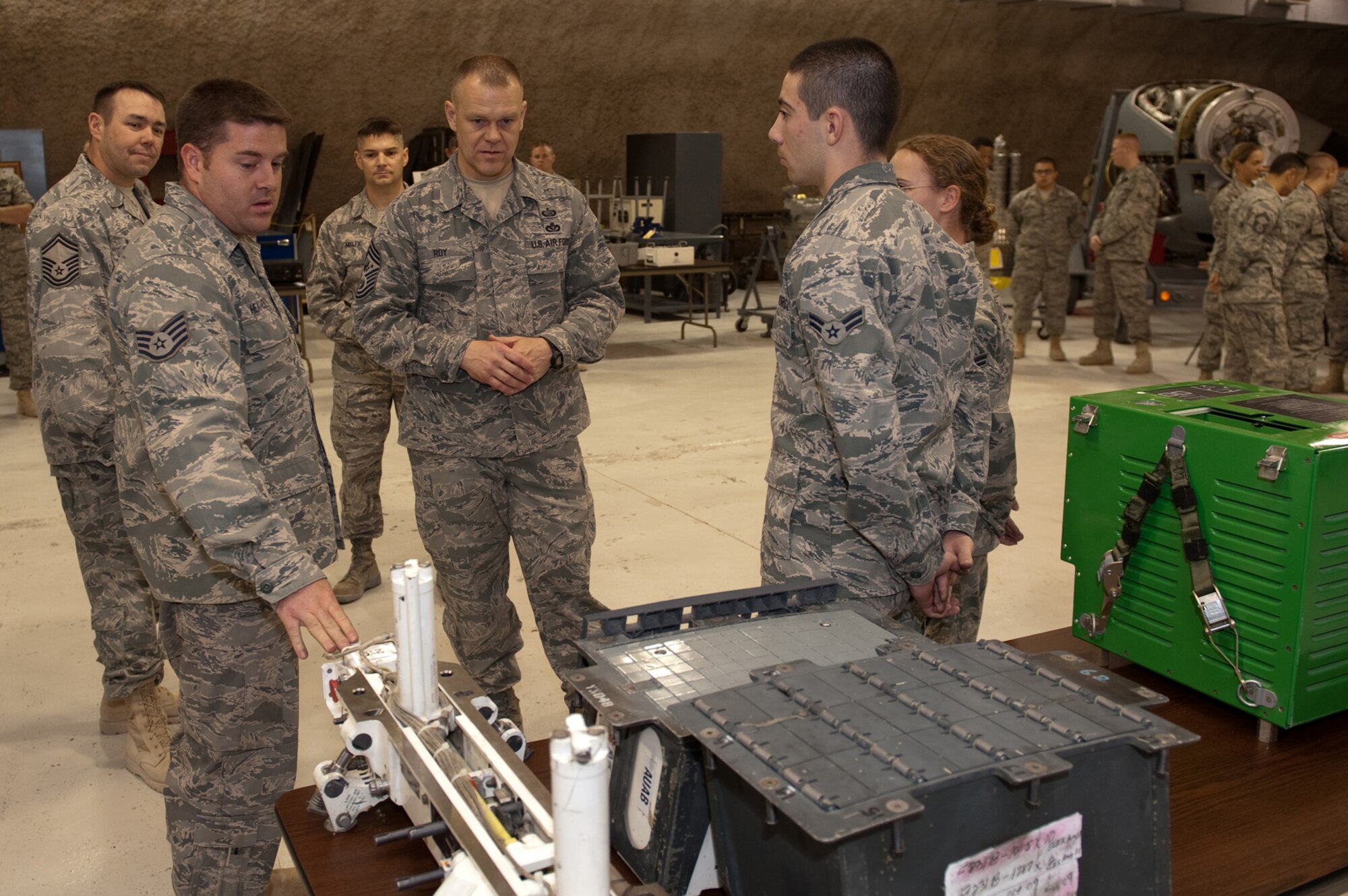 Chief Master Sgt. of the Air Force James A. Roy receives a briefing from Staff Sgt. James Heatherly on his role in maintaining aircraft weapons systems, Nov. 30, 2009. Chief Roy is touring the U.S. Air Forces Central Command area of responsibility, visiting with Airmen and addressing numerous issues affecting service members who are deployed in support of operations Iraqi Freedom and Enduring Freedom. (U.S. Air Force photo/Staff Sgt. Robert Barney)