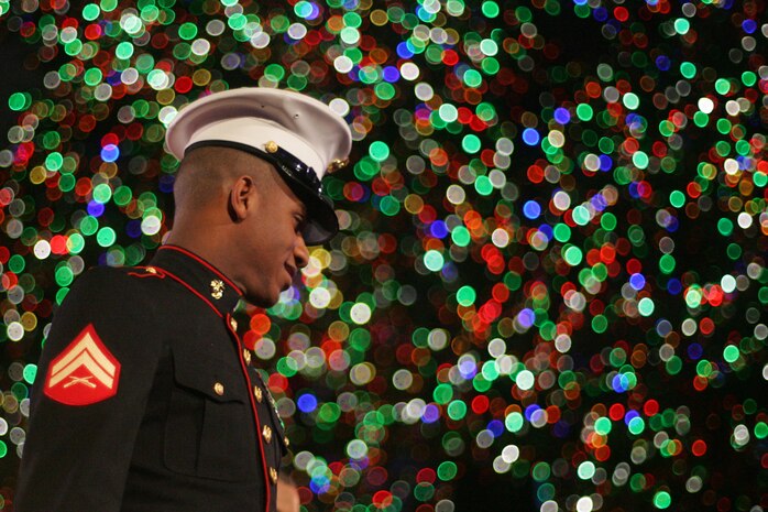 NEW YORK -- A Marine from 6th Communications Battalion, 4th Marine Logistics Group, who recently returned from an Iraq deployment leaves the stage after joining New York City mayor Michael Bloomberg and musicians Michael Buble and Aretha Franklin in lighting the 76 ft. Christmas Tree during NBC's 77th Annual Live Holiday Celebration, Dec. 2. Marines from numerous local units attended the event as special guests in front of the stage for the evenings celebration. (Official Marine Corps photo by Sgt. Randall A. Clinton)