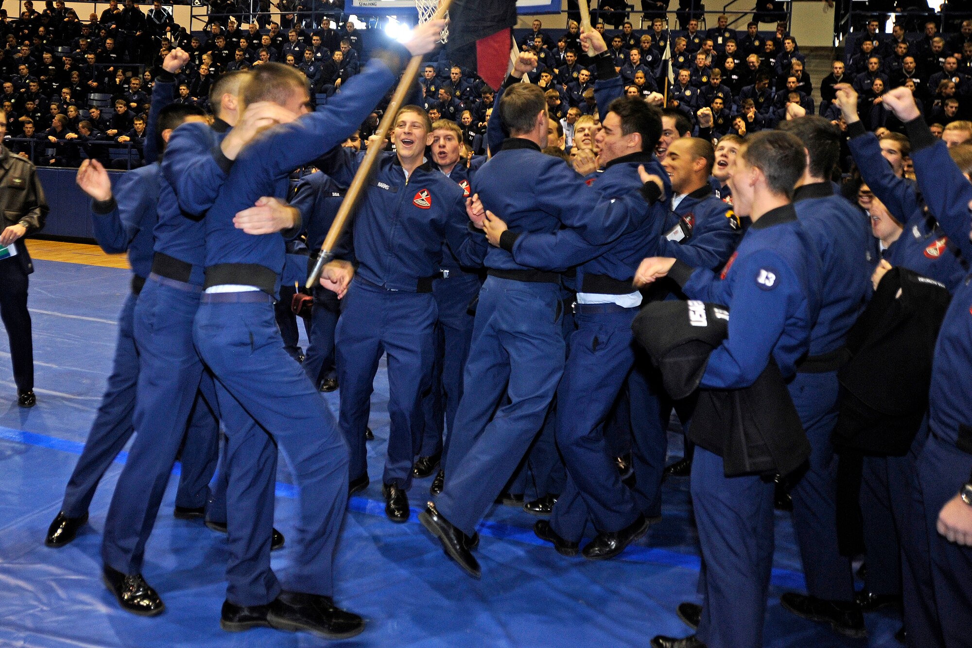 Cadet Squadron 23 cadets celebrate their second-straight victory in the Commandant's Challenge at the Air Force Academy's Clune Arena Nov. 24, 2009. CS23 also shared first place in the "Falcon Feud" military knowledge competition with CS40. (U.S. Air Force photo/Johnny Wilson)