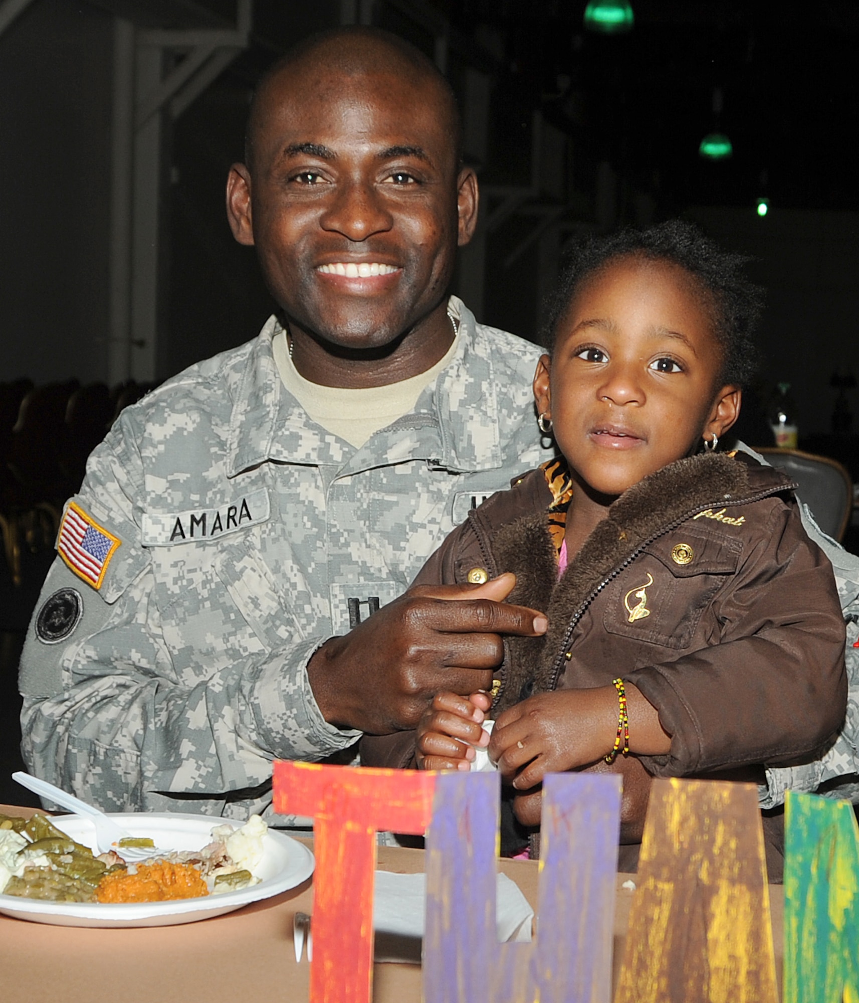 Army Capt. Peter Amara and daughter Mary were among the more than 100 attendees at the 8th annual Harvest Fest held at the Fort McArthur Youth Center, San Pedro, Calif., Nov. 19. Children and staff from the Youth Programs prepared food for the celebration and the children demonstrated what they’ve learned through the YP classes. (Photo by Joe Juarez)