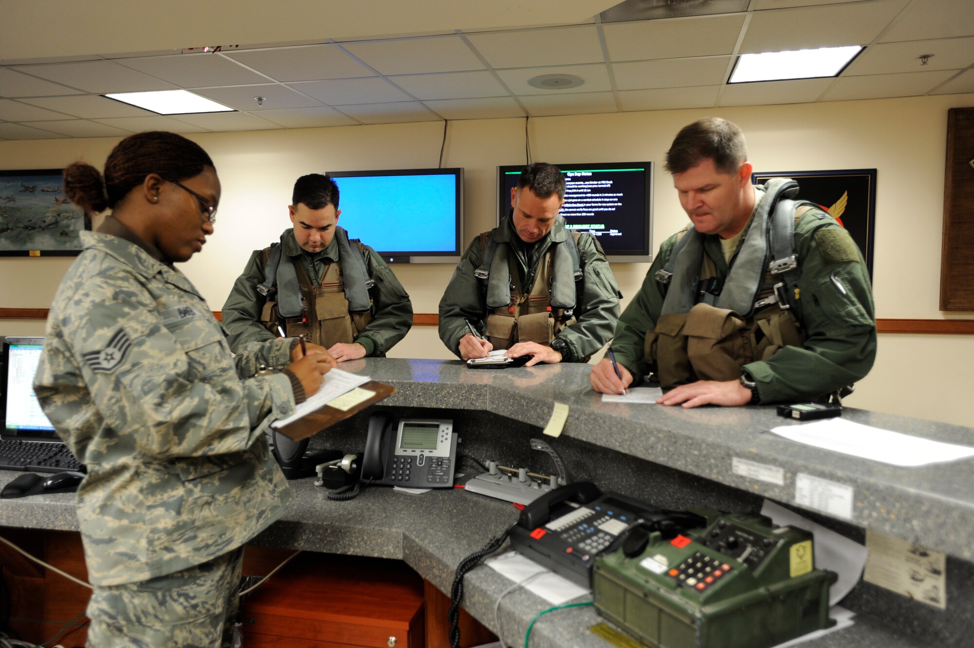 51st Fighter Wing Commander Col. Thomas Deale, far right, prepares for his Fini Flight Dec. 2 at Osan Air Base, along with Lt. Col. Mark Barrera (far left) and Maj. Patrick Crupi, both 51st Fighter Wing. Colonel Deale will relinquish command to Col. Patrick Malackowski during a ceremony at Osan Dec. 7. (U.S. Air Force Photo by Senior Airman Stephenie Wade) 