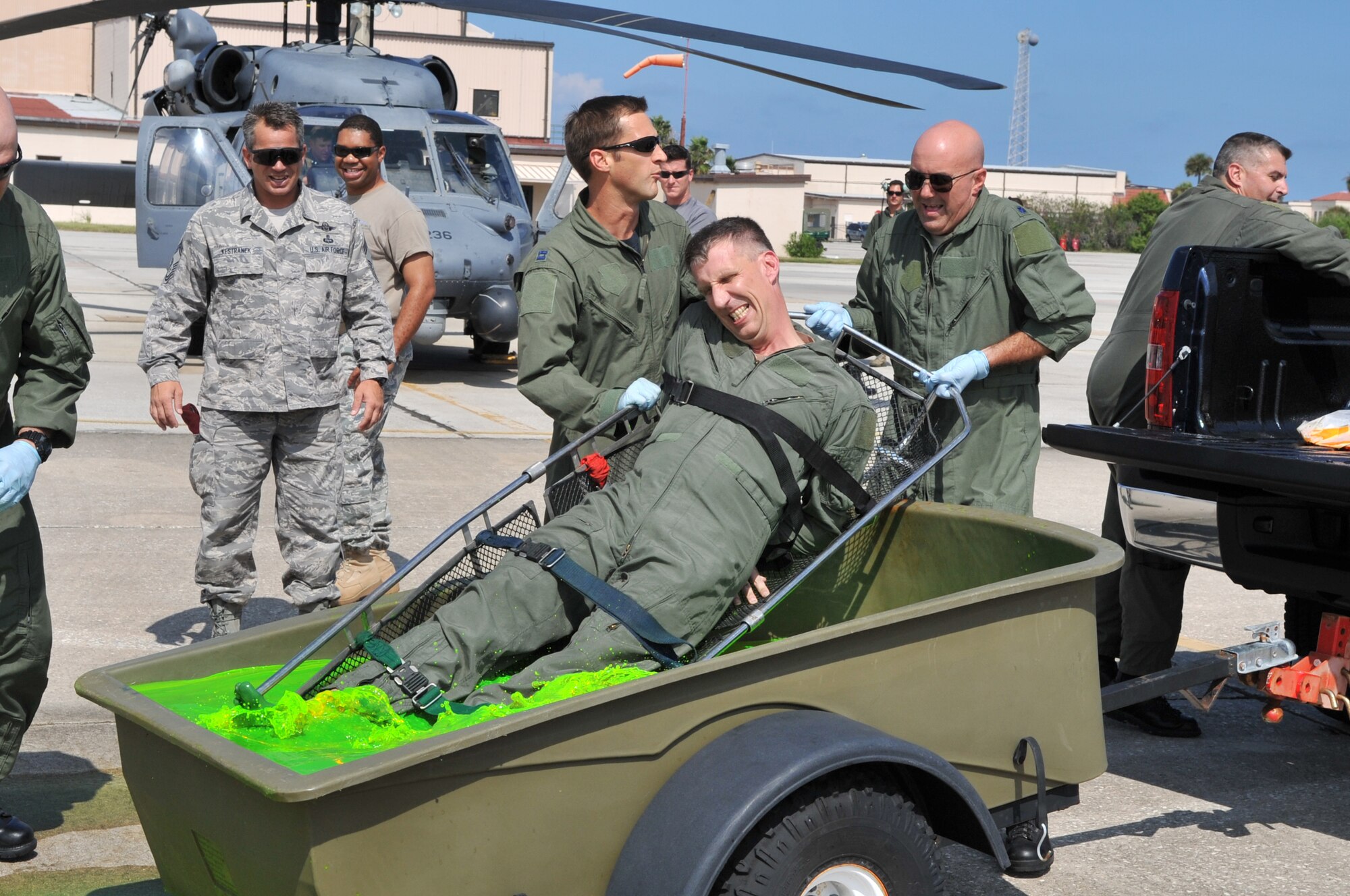 PATRICK AIR FORCE BASE, Fla. - Col. Macrander is gently placed into the frigid water during his final flight "ceremony." Co-workers and other pilots take part in this fini-flight. (U.S. Air Force photo/John Connell)
