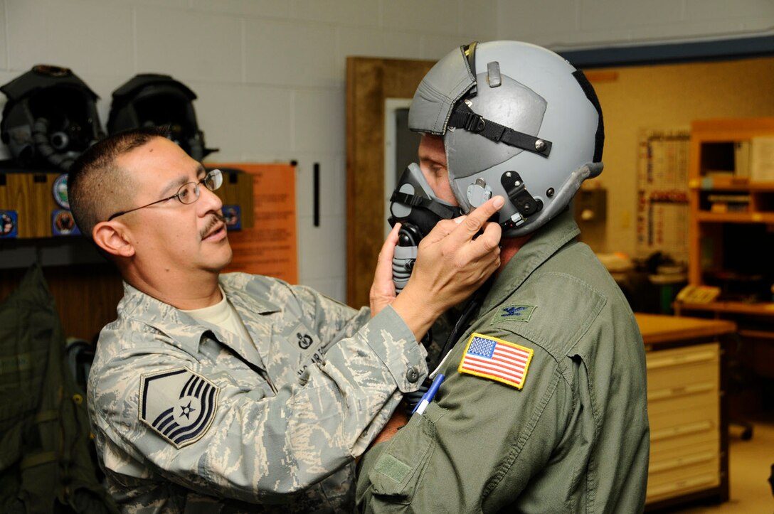 Col. Paul Hargrove gets fitted with helmet and mask in Fresno's Life Support Shop before his recent incentive ride with the 144th Fighter Wing's F-16s Nov. 3