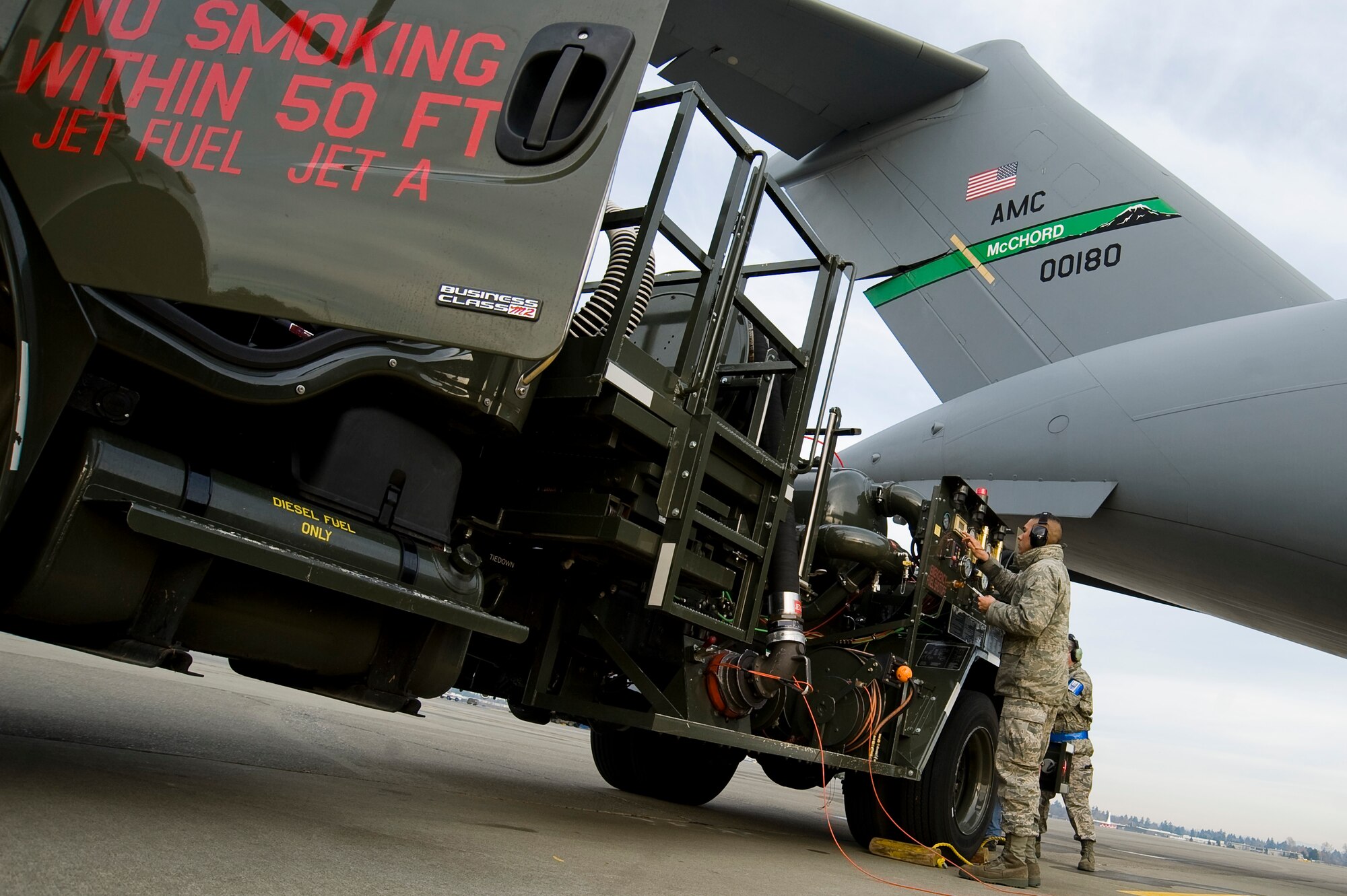 Airman Julio Chavez, a fuels distribution operator assigned to the 62nd Logistics Readiness Squadron here, completes paperwork following a successful Jet A commercial fueling of a C-17 Globemaster III on the McChord flightline Thursday. (U.S. Air Force photo/Abner Guzman)