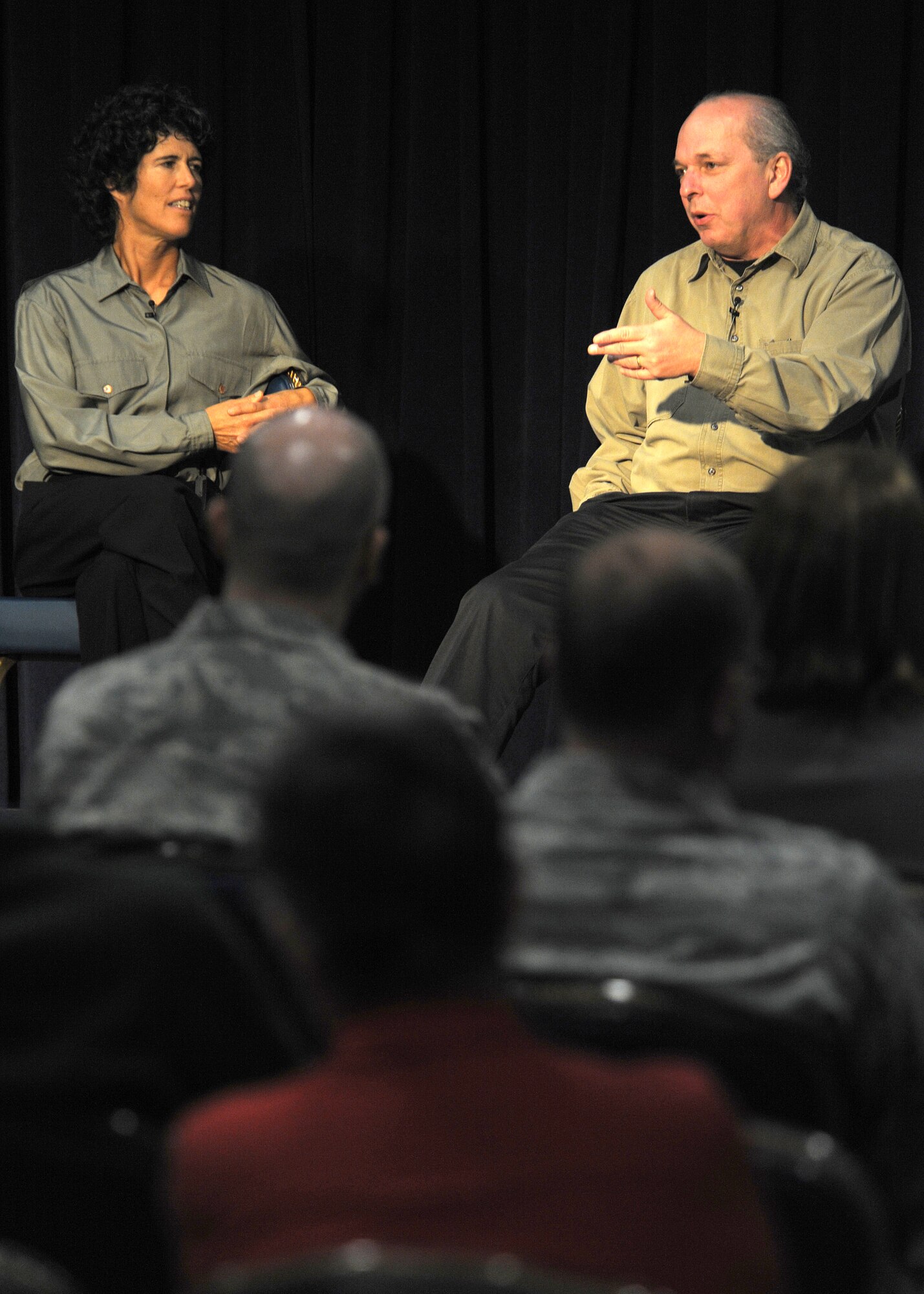 Carrie Gibson (left) and Anthony Curry, actors from Had to Be Productions, reenact an interview with a post-deployment veteran in their performance, “Into the Fire,” at the Gordon Conference Center, Nov. 19. Hosted through the Base Chaplain’s Office, the theatrical documentary play explored the challenges associated with traumatized military members entering back into society and the workplace after returning from overseas.  (Photo by Atiba Copeland)