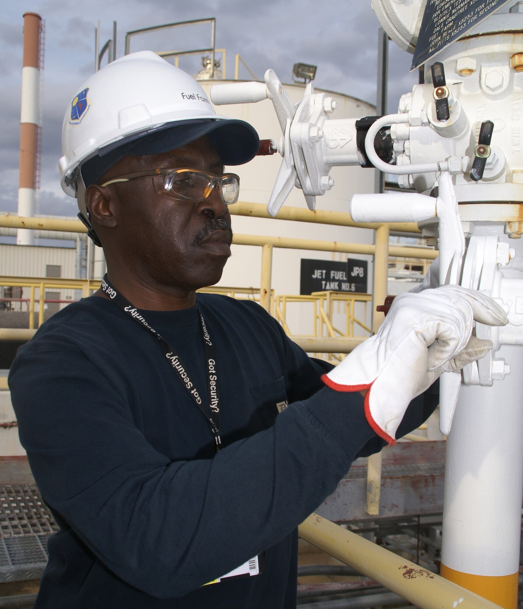 Charles Easley, a fuels specialist at Arnold Engineering Development Center, adjusts a valve controlling the flow of JP-8 from the fuel farm to one of the test facilities on base. (Photo by Philip Lorenz III)