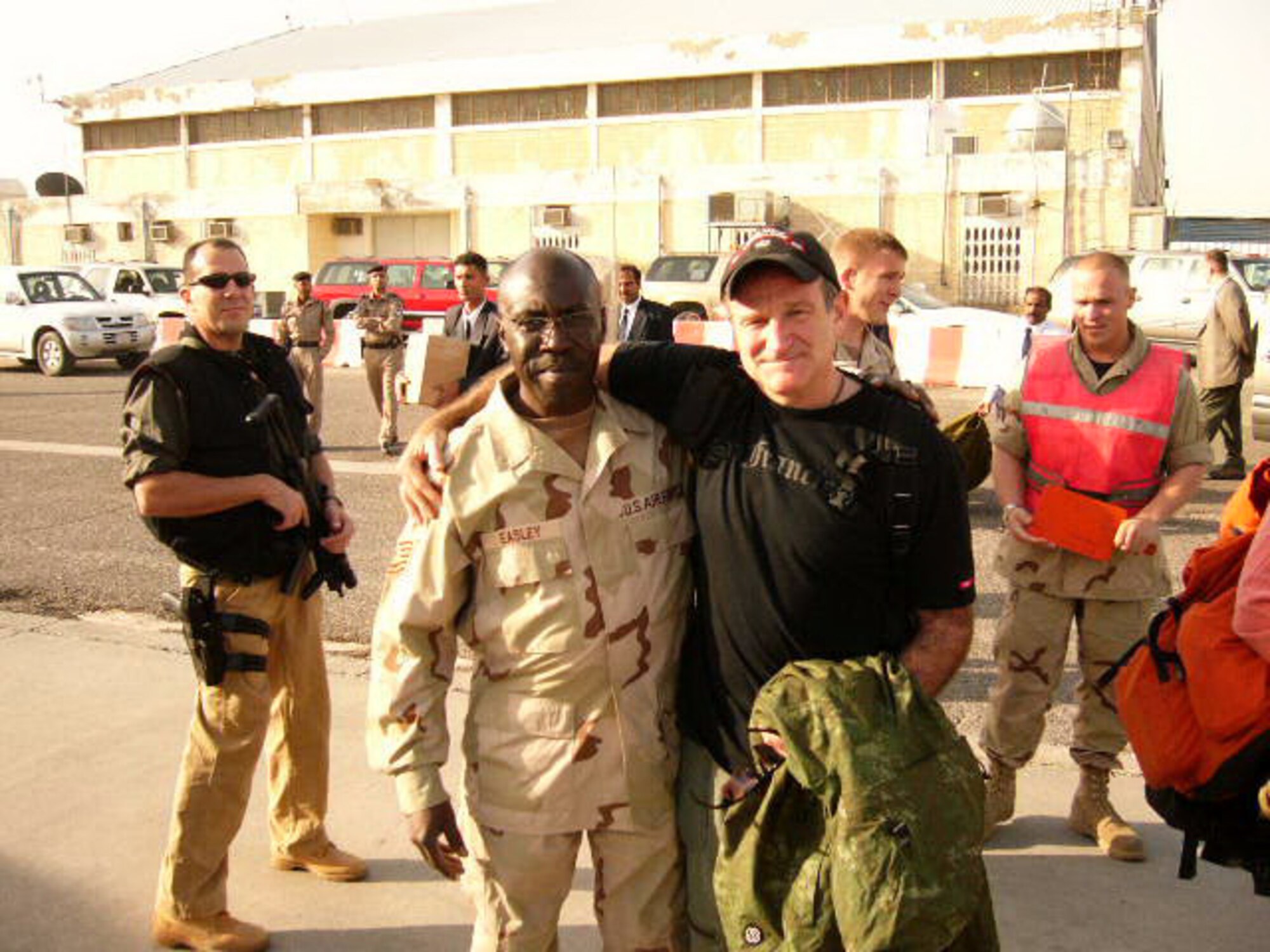 Then Technical Sergeant Charles Easley poses with actor Robin Williams during a USO event in Kuwait during Operation Northern Watch in 2003. Easley, who retired from the military as a master sergeant, said he went to the desert three times, the first being to Kuwait for Operation Northern Watch. After 9/11, he deployed for Enduring Freedom, ending up in Baghdad when conditions there were still primitive for the troops. (Photo provided)