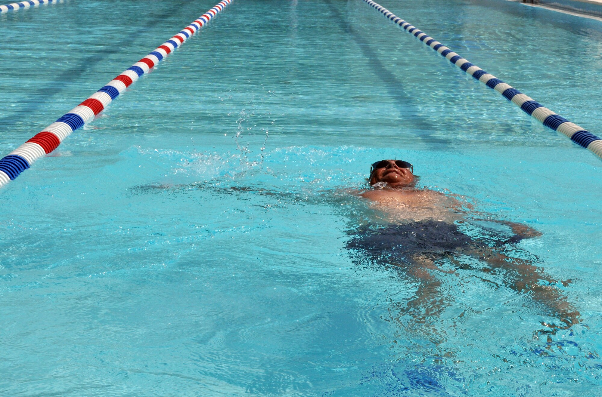 A retiree swims laps at the Eglin Air Force Base pool.  The pool is open 6:30 am - 6:30 pm, every day except Wednesday to anyone with a military ID for a fee of $2 per person. (U.S. Air Force photo/ Airman Anthony Jennings)