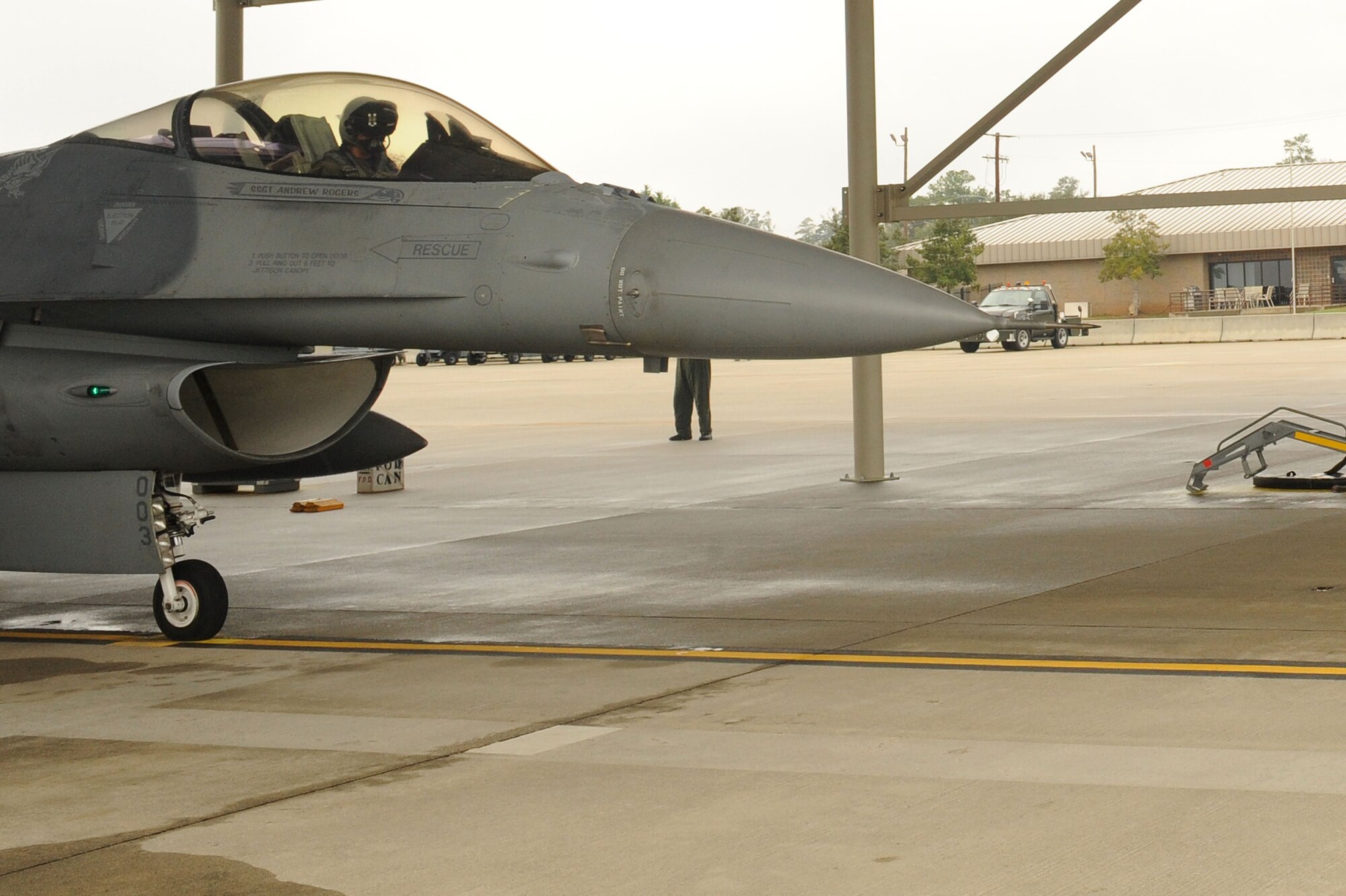 SHAW AIR FORCE BASE S.C -- An F-16 alert pilot goes over his checklist before takeoff during exercise Fertile Keynote Nov 19. According to Master Sgt. William Partin, alert NCO-in-charge, sometimes pilots will sit in their cockpit for as long as an hour, waiting for the go-ahead to take off. "The new marquees give (the pilots) direct communication with the operations desk, like coordinates to the target and when to start their engines." Pilots can see the marquees from their cockpit. "Down here they (the pilots) train to intercept aircraft," said Airman 1st Class Andrew Norton, alert maintainer. "They'll launch a Civil Air Patrol aircraft from another base, and our pilots track him on radar to escort him out of our airspace." Maintainers and pilots work 24 or 48-hour shifts to react 24/7 if the alarm sounds. (U.S. Air Force photo/Senior Airman David Minor)