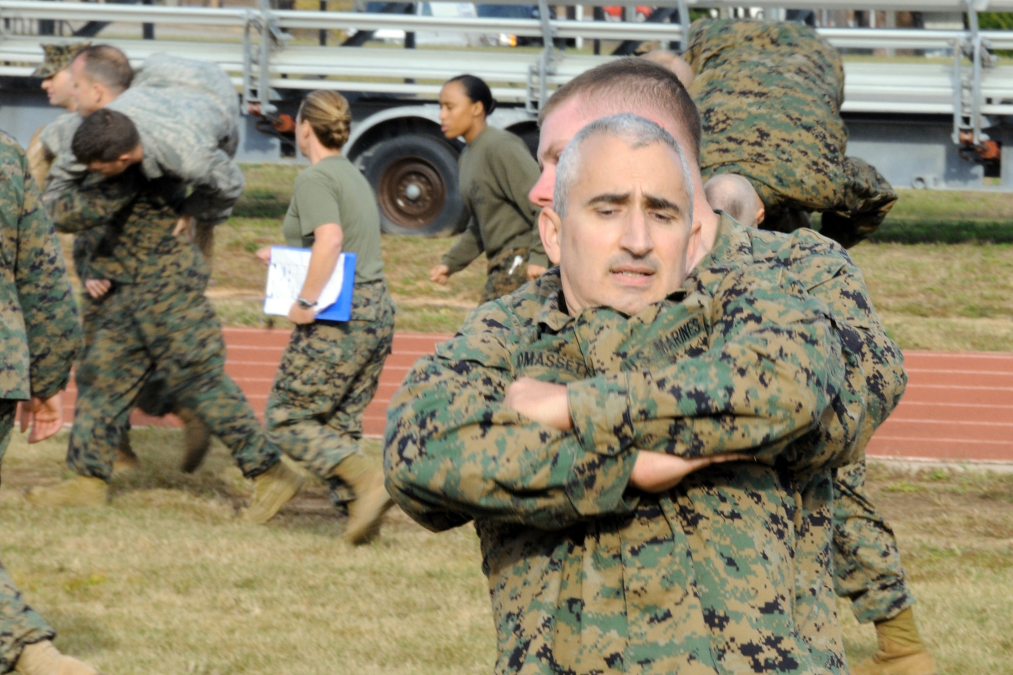 Marines from the 33rd Fighter Wing and Airmen from across Eglin Air Force Base take part in the Marines' combat fitness test Nov. 25, at Eglin AFB, Fla. Airmen were invited to participate by the Marines, who were testing as part of their annual fitness program. (U.S. Air Force photo/Staff Sgt. Bryan Franks)