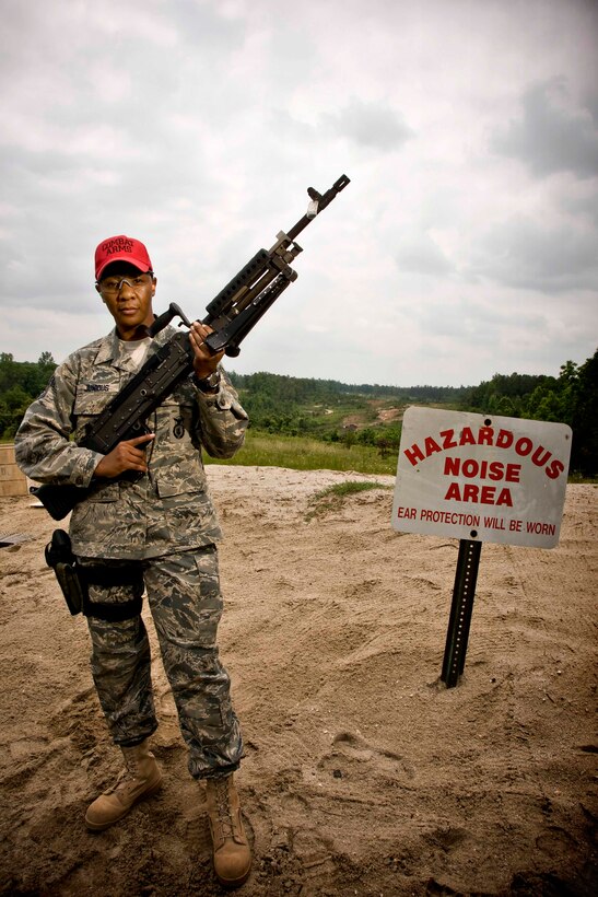 Tech Sgt. Sharese Junious serves as a Combat Arms Instructor, or CATM, who routinely qualifies 459th Air Refueling Wing members in firearms training. Originally from Chicago, Sergeant Junious enlisted in 1997 and served tours in Georgia, South Korea, and Guam. She finished up her active duty commitment at what is now the 89th Airlift Wing and joined the 459th ARW in 2007. (U.S. Air Force Photo/Capt. Nick Strocchia)