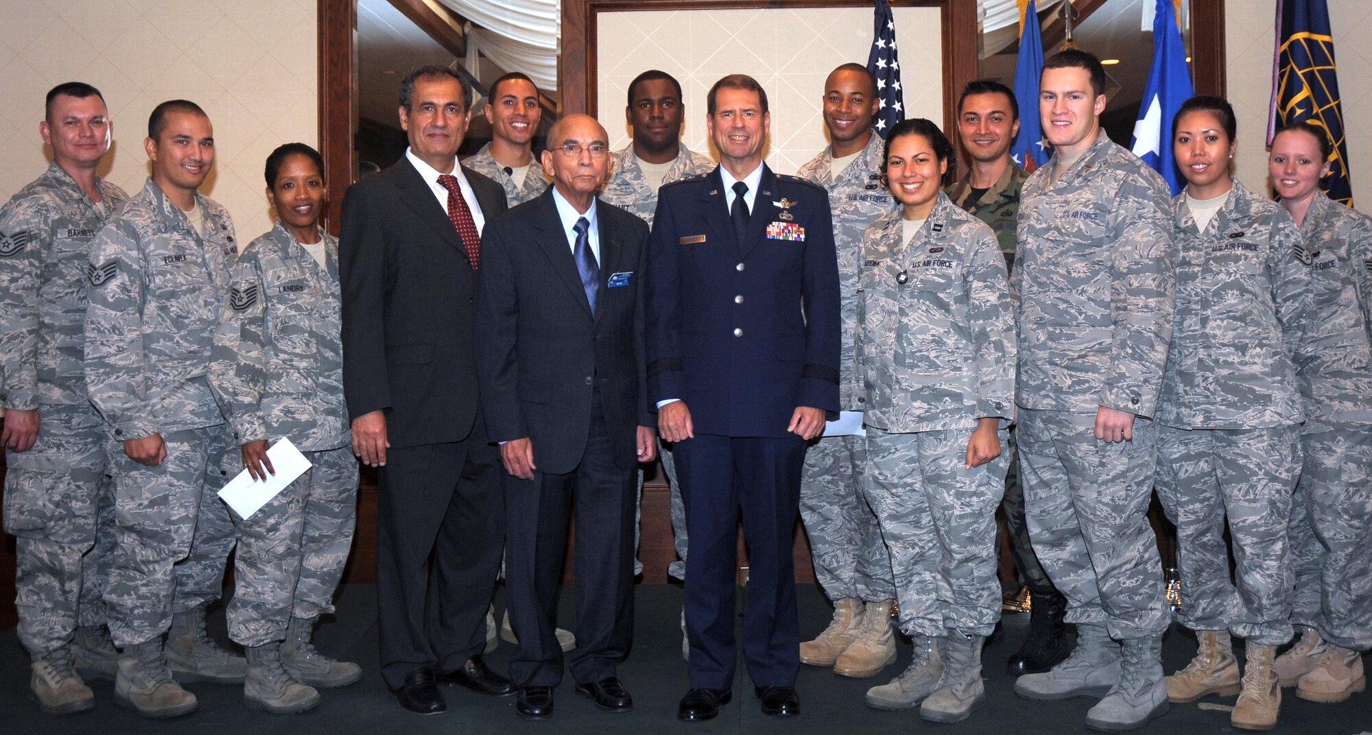 Award recipients gather around Lt. Gen. Tom Sheridan (center), Space and Missile Systems Center commander, and officials from the Armed Forces Communications and Electronics Association during the AFCEA award luncheon last month. General Sheridan was the keynote speaker for the event, which AFCEA’s Los Angeles Chapter presented scholarships and monetary awards to military recipients in the local area. (Photo by Atiba Copeland)