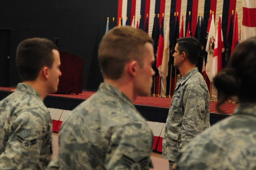 Col. Steven Basham, 2d Bomb Wing commander, addresses 2d BW Airmen in preparation the upcoming conventional operational readiness inspection. Colonel Basham said, “I know you are tired and worn out” and sympathized about the long hours and missed weekends they have contributed to the mission.  He advised them that he would again call on their excellence and attention to detail for the upcoming CORI, and reminded Airmen to always remember their reason for serving for inspiration. (U.S. Air Force photo by Senior Airman Joanna M. Kresge)