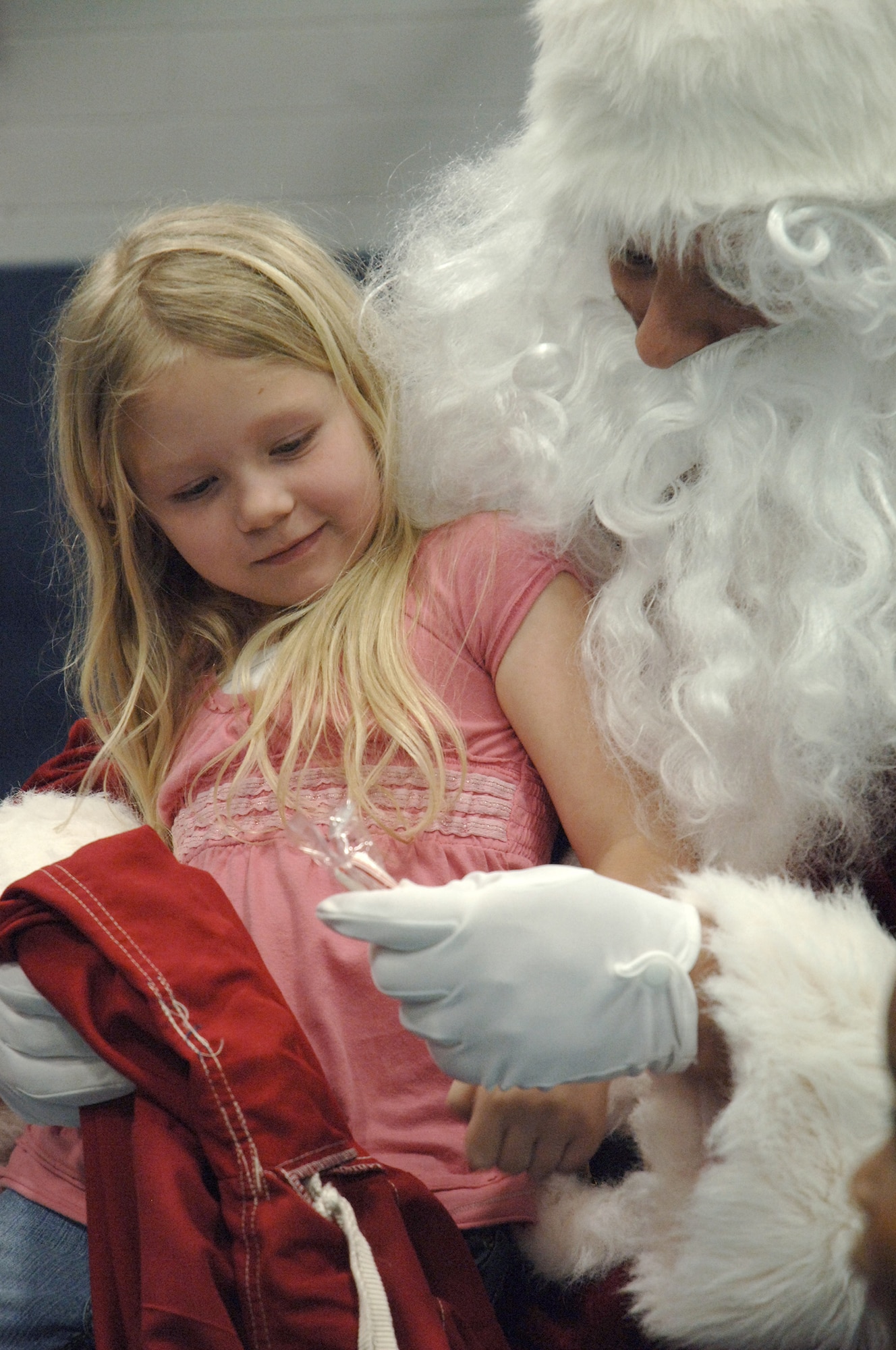 Taylor Lippy sits on Santa's lap at the annual base Holiday Tree Lighting ceremony at the Youth Programs Center here Dec. 2. Charleston AFB hosted the annual event which included caroling, crafts, awards and a special appearance by Santa Claus. Taylor is the daughter of Tech. Sgt. Keith Lippy who is with the 437th Security Forces Squadron.  (U.S. Air Force photo/ Airman 1st Class Lauren Laidlaw)
