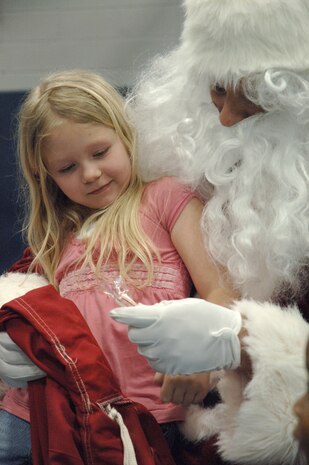 Taylor Lippy sits on Santa's lap at the annual base Holiday Tree Lighting ceremony at the Youth Programs Center here Dec. 2. Charleston AFB hosted the annual event which included caroling, crafts, awards and a special appearance by Santa Claus. Taylor is the daughter of Tech. Sgt. Keith Lippy who is with the 437th Security Forces Squadron.  (U.S. Air Force photo/ Airman 1st Class Lauren Laidlaw)