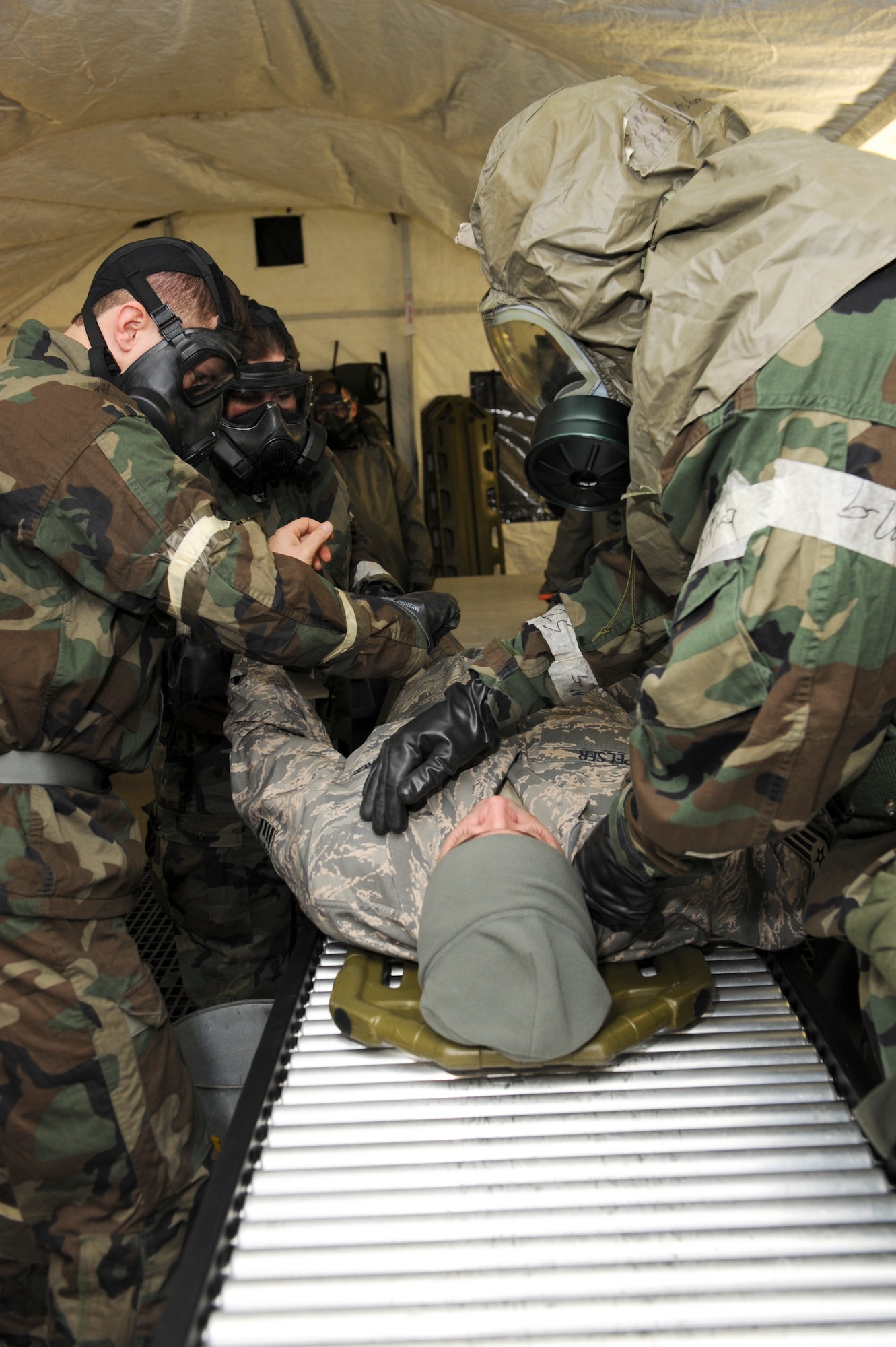 ELMENDORF AIR FORCE BASE, Alaska -- Members from the 3rd Medical Group decontaminate a victim during a medical inject for the base wide exercise, Polar Force 10-1 Dec. 3. Victims that show symptoms of being in a chemical attack is decontaminated prior to receiving further medical attention. The exercise contians a variety of scenarios that test the Arctic Warriors ability to handle real world situations. (U.S. Air Force photo/ Staff Sgt. Joshua Garcia)