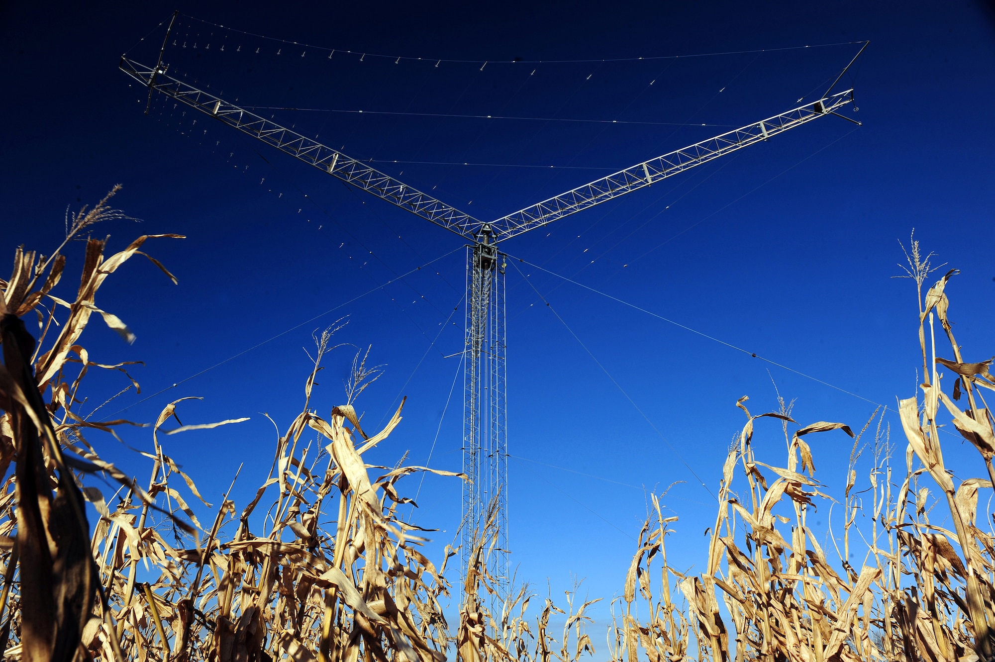 One of eight directional rotatable log periodic antennas stands tall behind a cornfield, Nov. 5, 2009, near Elkhorn, Neb. The directional rotatable log periodic antennas can rotate 360 degrees. A crew of telecommunications specialists maintained by the 55th Strategic Communications Squadron from Offutt Air Force Base, Neb., monitor the antennas, which support a wide variety of missions from executive levels of government to NASA. (U.S. Air Force photo/Josh Plueger)
