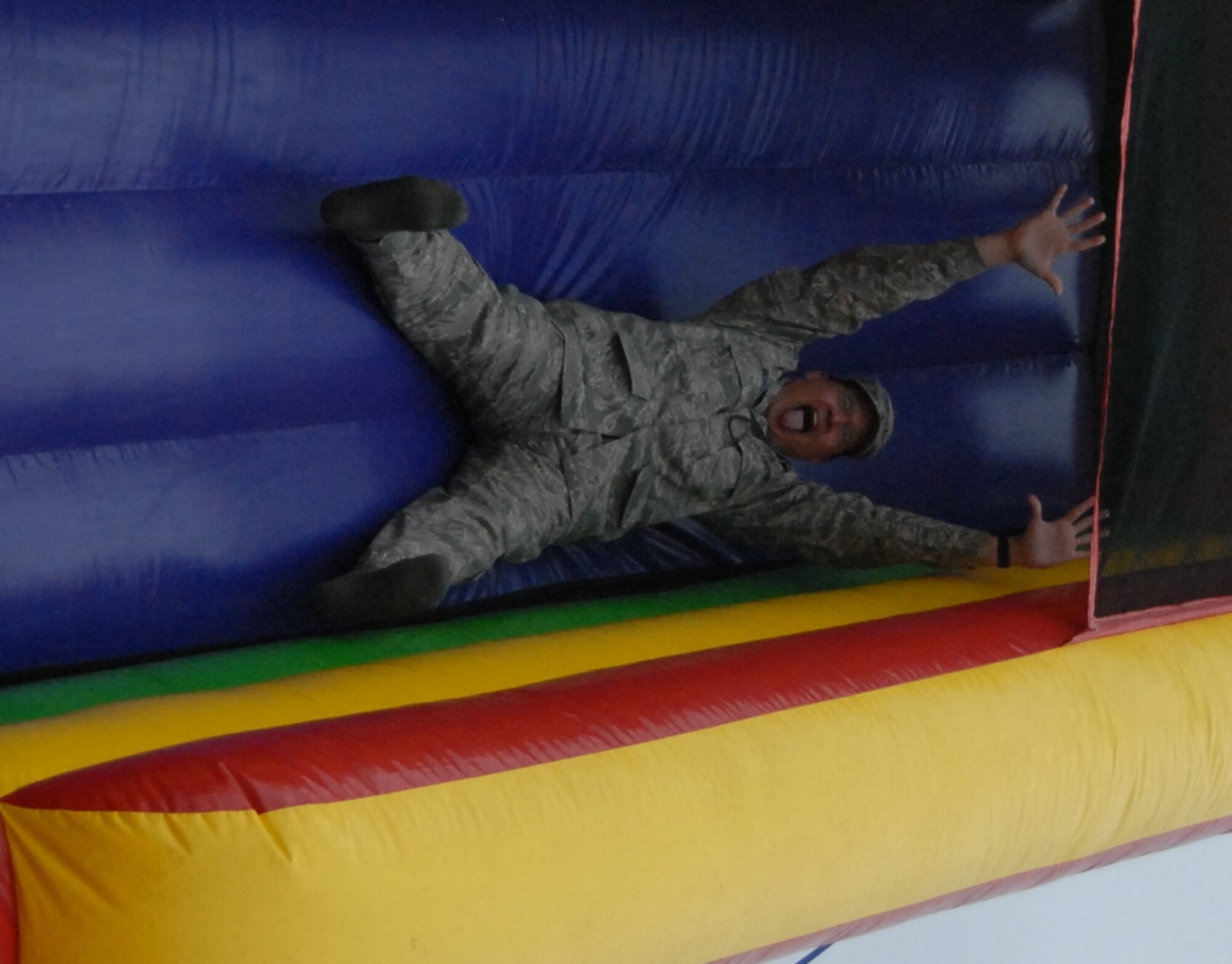 Pope’s first sergeants gathered at the Pope Community Center Nov. 24 to fry up a Thanksgiving feast for the dorm residents. The cool afternoon winds didn’t spoil the
fun as the Airmen gathered inside the building for a time of food and music. An inflatable slide added to the entertainment as many visitors, including Chaplain (Lt. Col.) Kenneth Reyes, 43rd Airlift Wing, kicked off their shoes and climbed
to the top to take a slide.