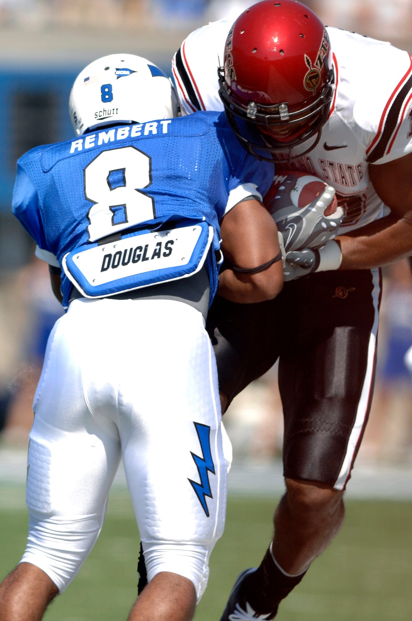 U.S. Air Force Academy junior defensive back Reggie Rembert tackles a San Diego State wide receiver during the Air Force's 26-14 win over San Diego State Sept. 26, 2009, at Falcon Stadium, Colo. Rembert, a native of Flower Mound, Texas, forced a fumble and returned an interception for a touchdown. (U.S. Air Force photo/Mike Kaplan)
