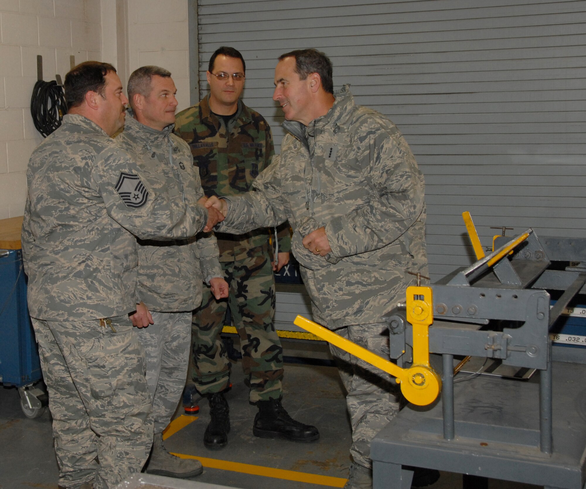 During a recent visit to the Niagara Falls Air Reserve Station, General Raymond Johns, Jr., AMC, Commander, toured a variety of groups and squadrons. This tour enabled the general to receive a firsthand feel of the association between the New York Air National Guard's 107th Airlift Wing and the Air Force Reserve's 914th Airlift Wing.  Front to back: The general is greeted by Senior Master Sgt's Steven Buchwald, 107th AW, Stephen Trosterud, 914thth AW and Joe Dellavalle, 914th AW. (U.S. Air Force Photo/Senior Master Sgt. Ray Lloyd)